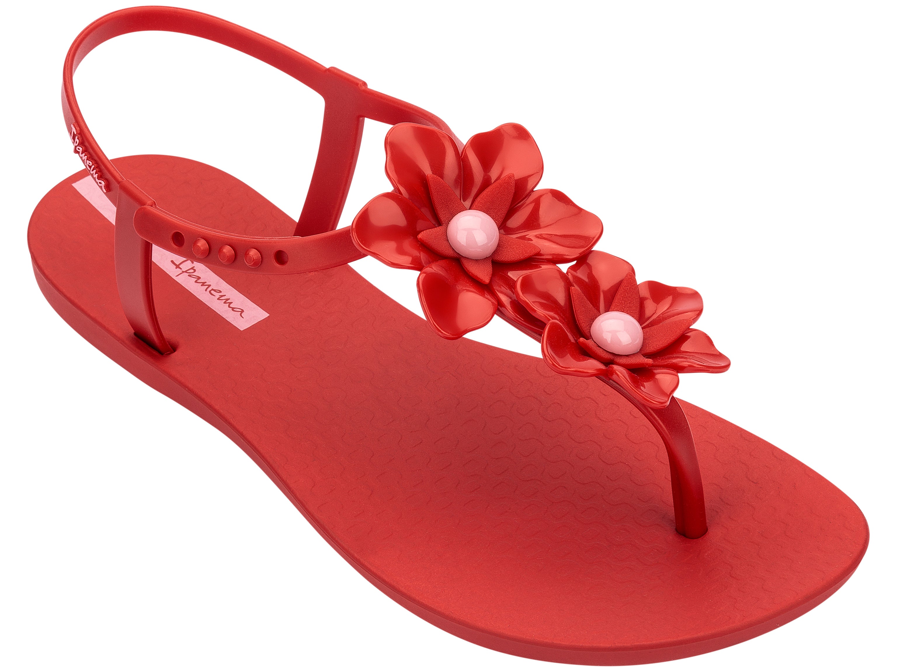 Angled view of a Red Ipanema Duo Flowers women's t-strap sandal with two flowers.