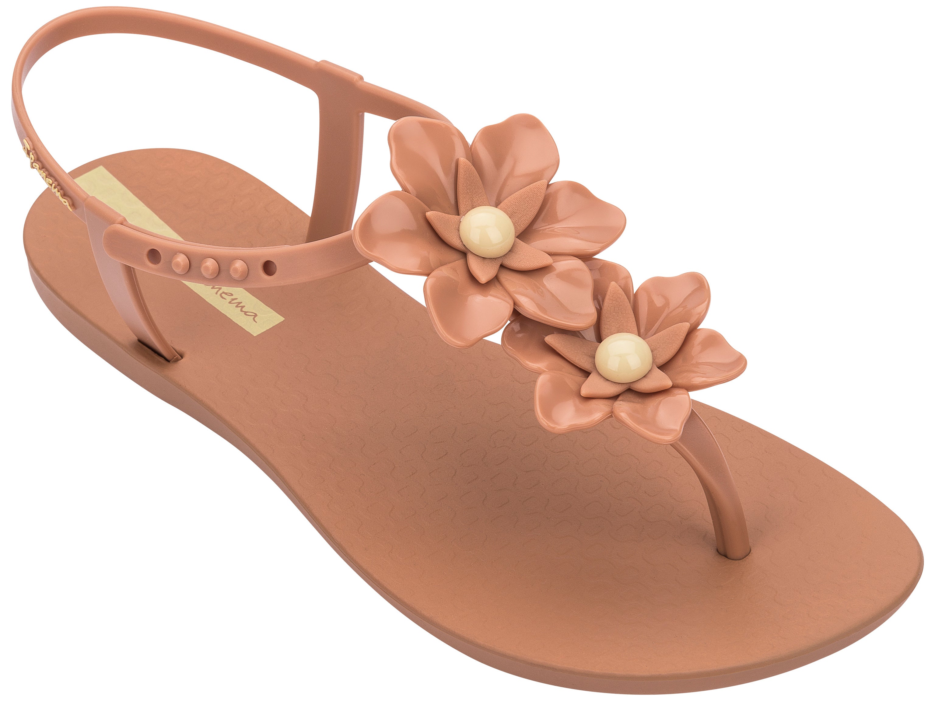 Angled view of a brown Ipanema Duo Flowers women's t-strap sandal with two flowers.