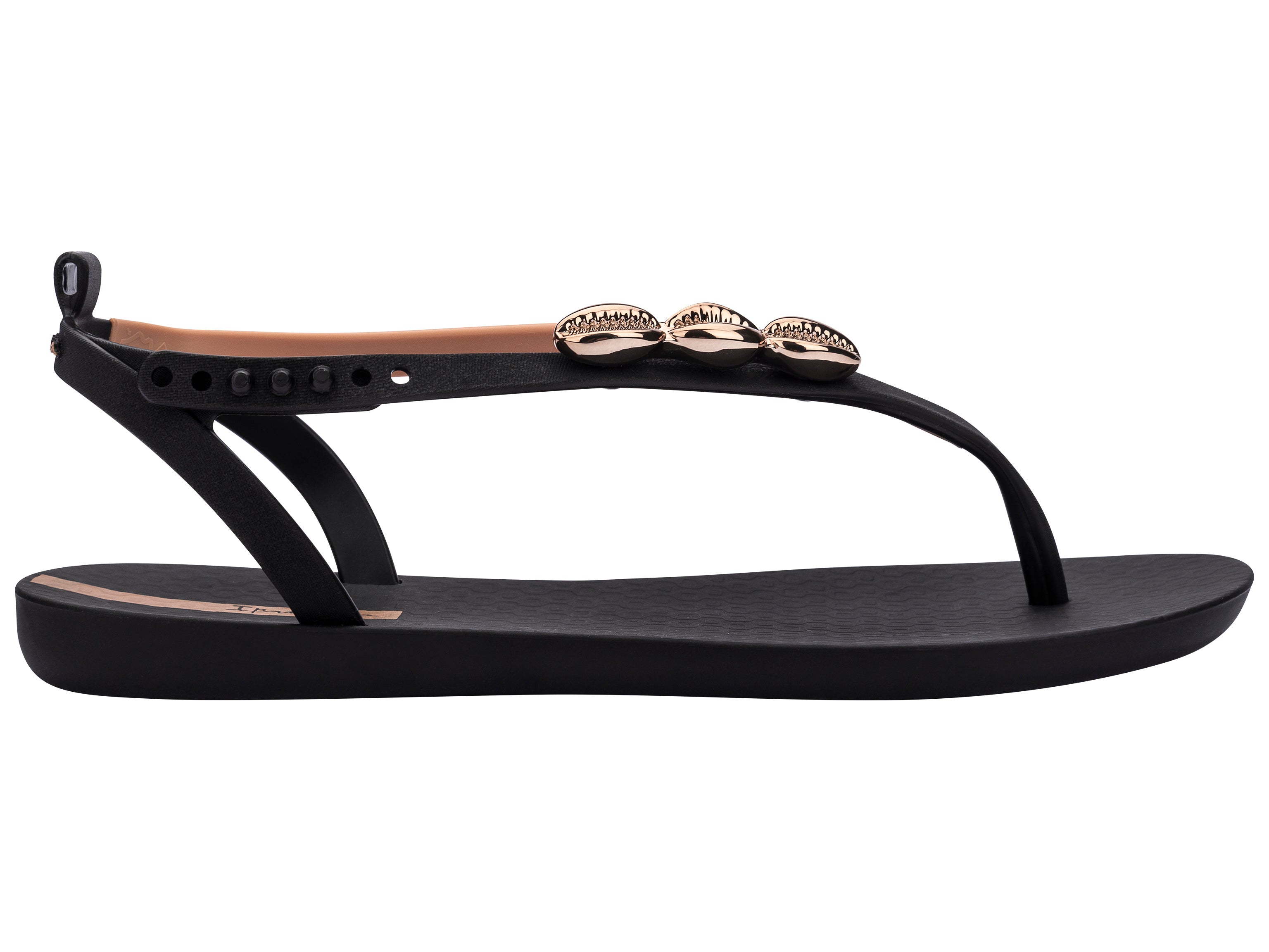 Outer side view of a black Ipanema Salty women's sandal with 3 gold shells on the strap.