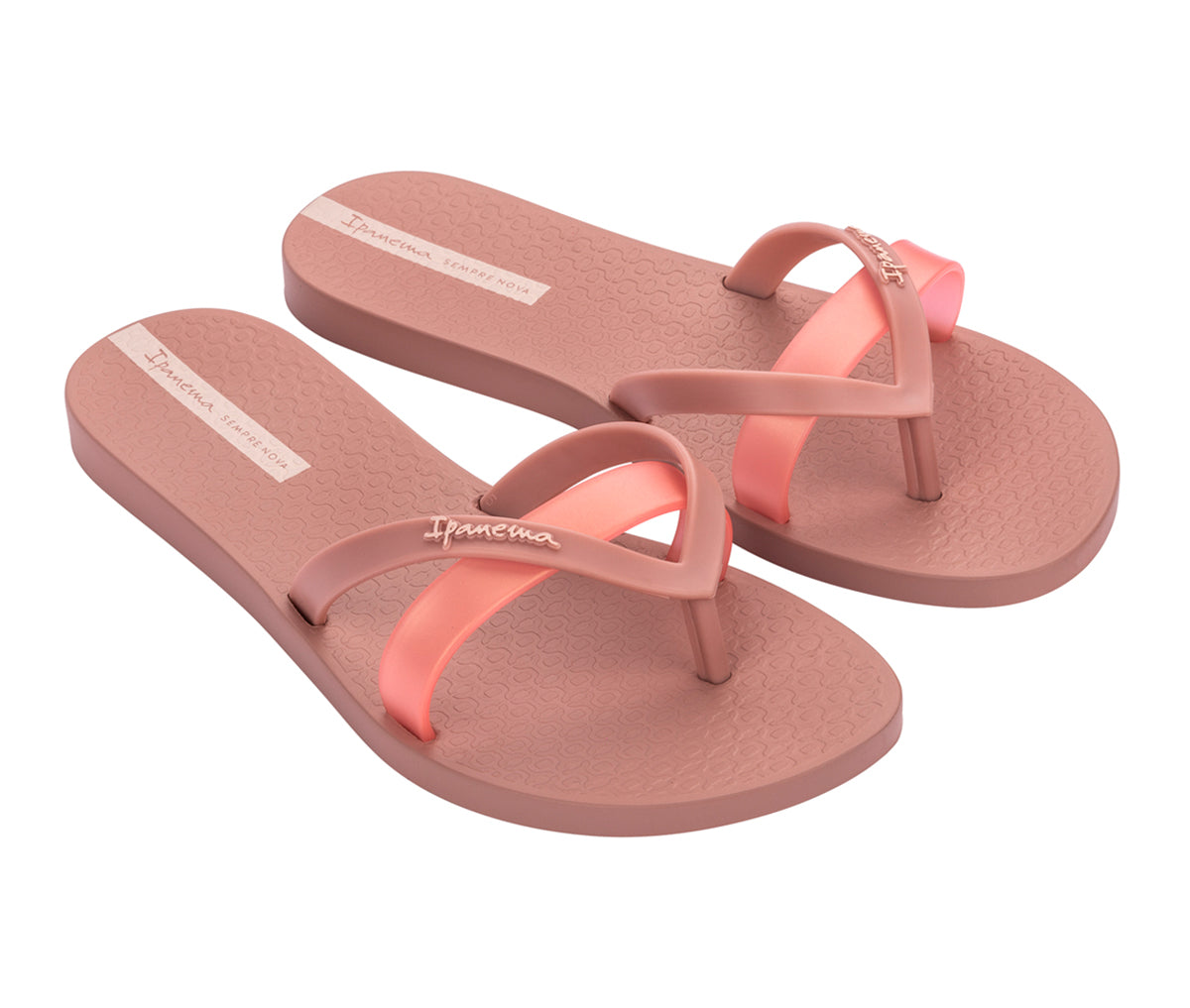 Angled view of a pair of pink with pearly pink strap Ipanema Kirei Slides