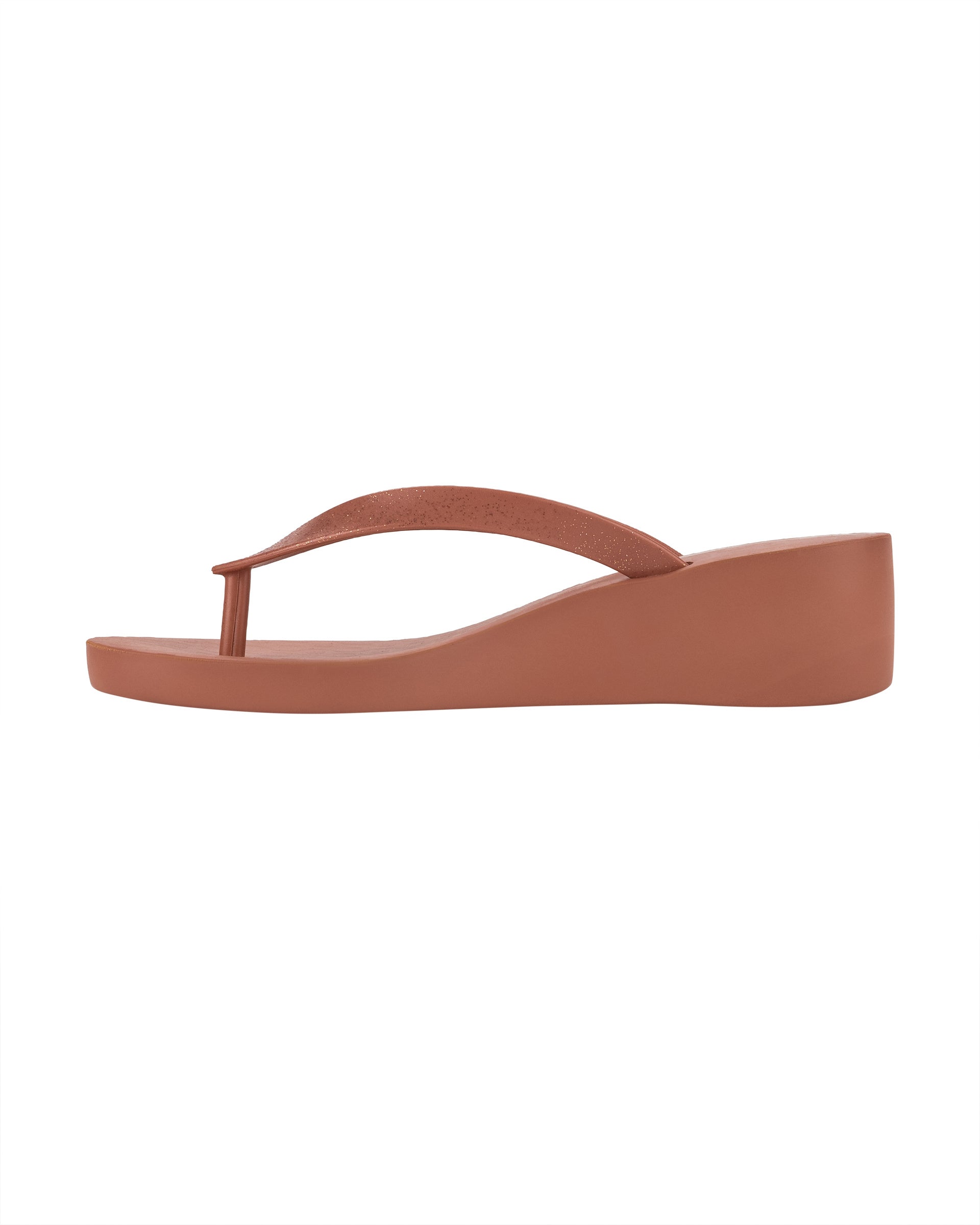 Inner side view of a pink Ipanema Selfie women's wedge flip flop with glitter pink straps.