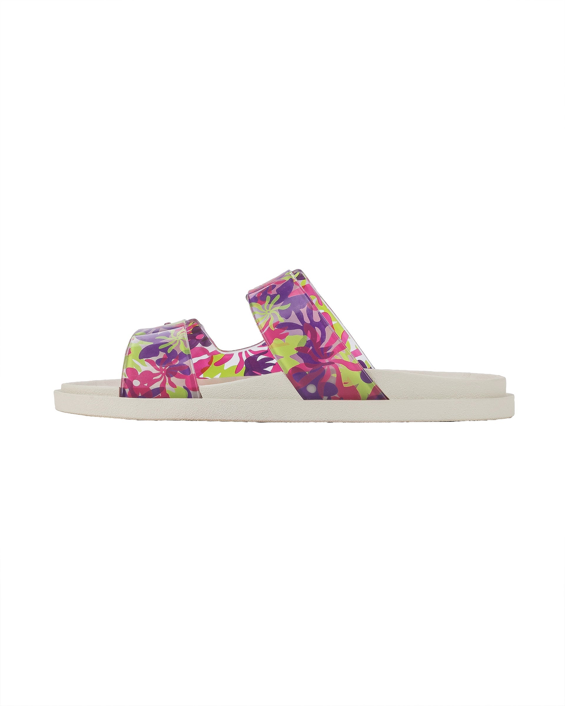 Inner side view of a beige Ipanema Follow kids slide with floral print on the upper.