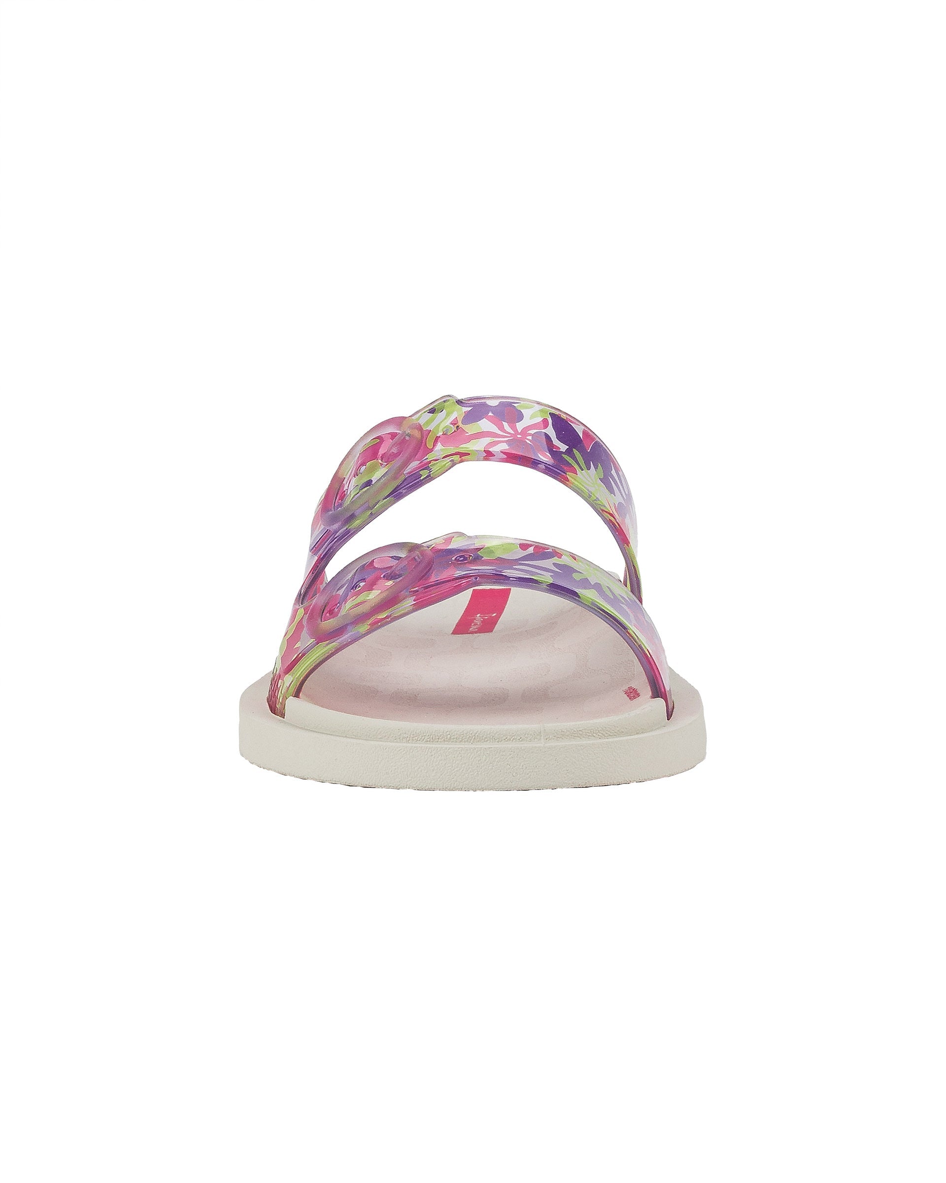 Front view of a beige Ipanema Follow kids slide with floral print on the upper.