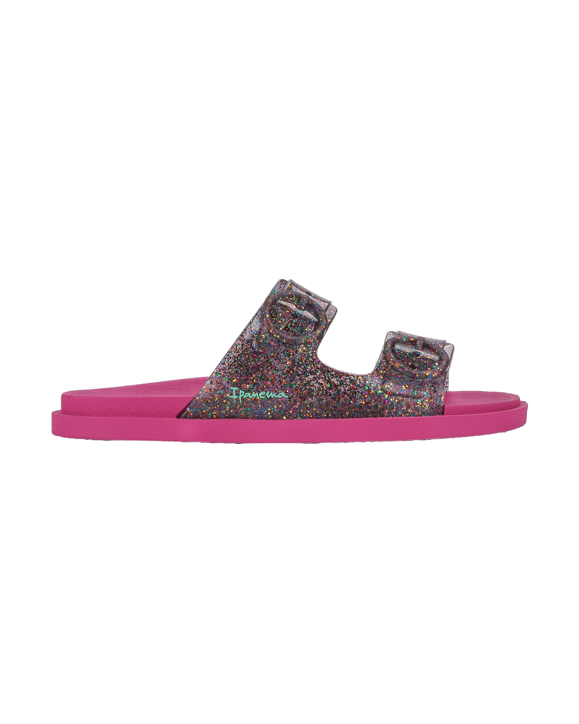 Outer side view of a pink Ipanema Follow kids slide with a multicolor glitter upper.