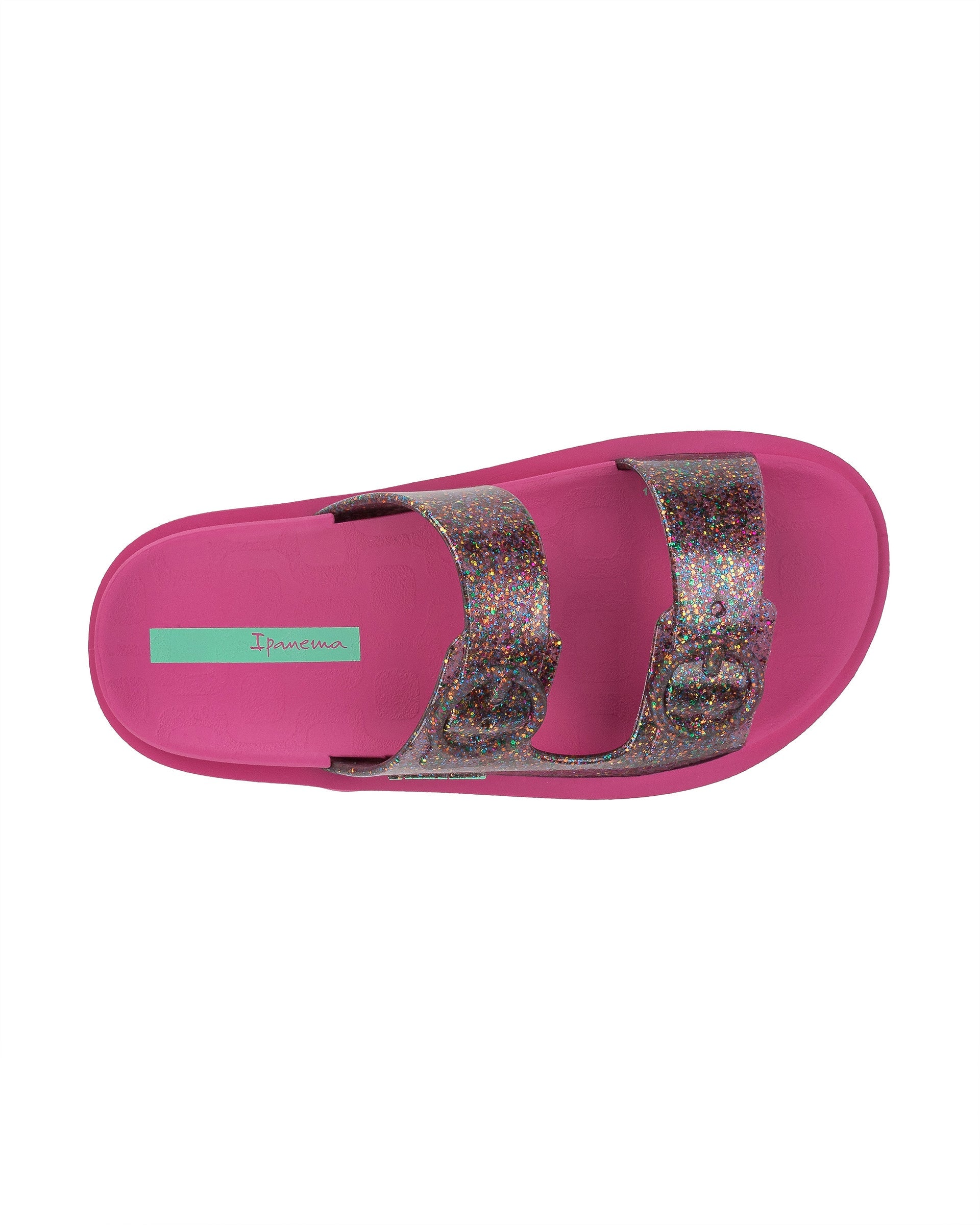 Top view of a pink Ipanema Follow kids slide with a multicolor glitter upper.