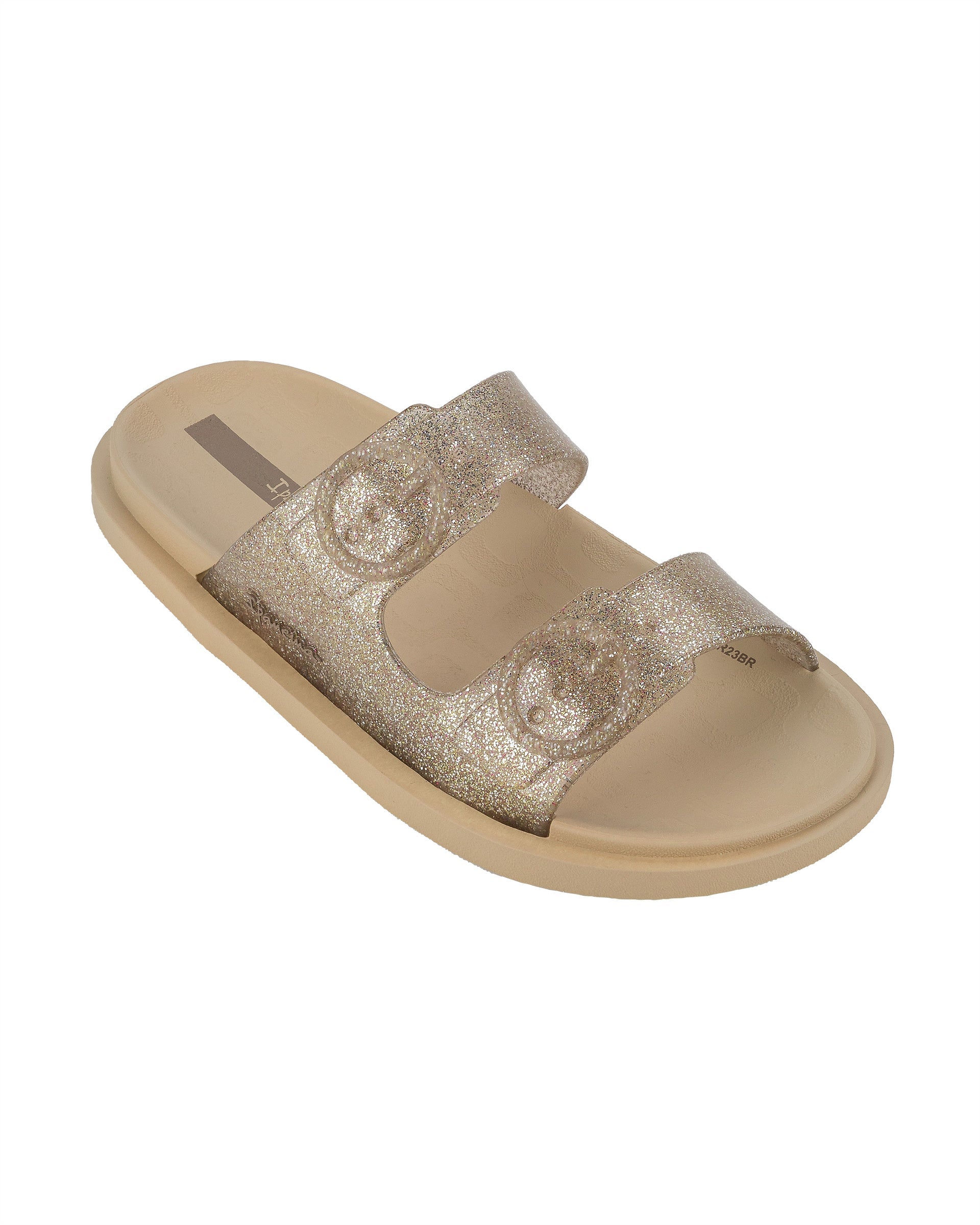 Angled view of a beige Ipanema Follow kids slide with a glitter upper.