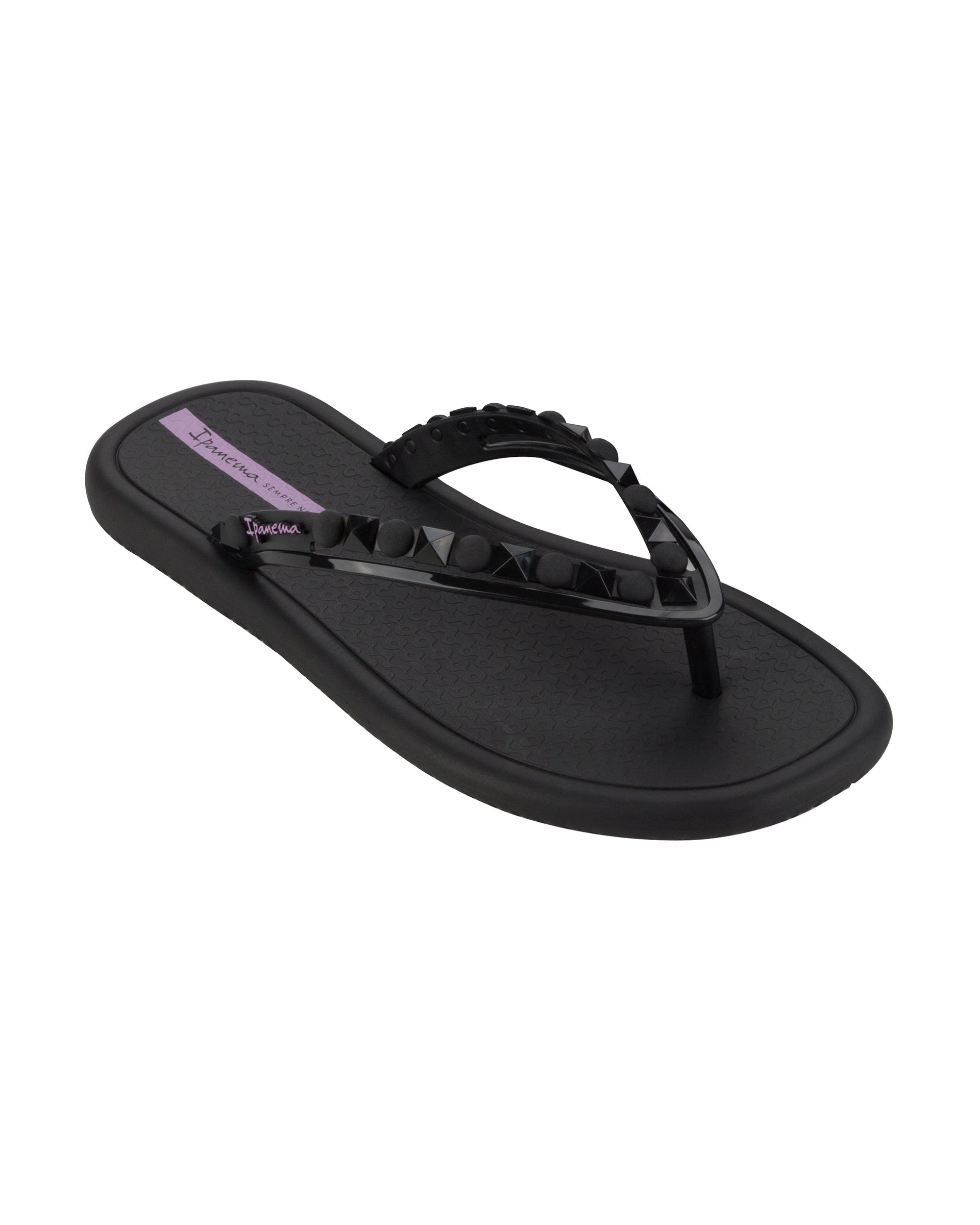 Angled view of a black Ipanema Meu Sol women's flip flop with stud details on strap.