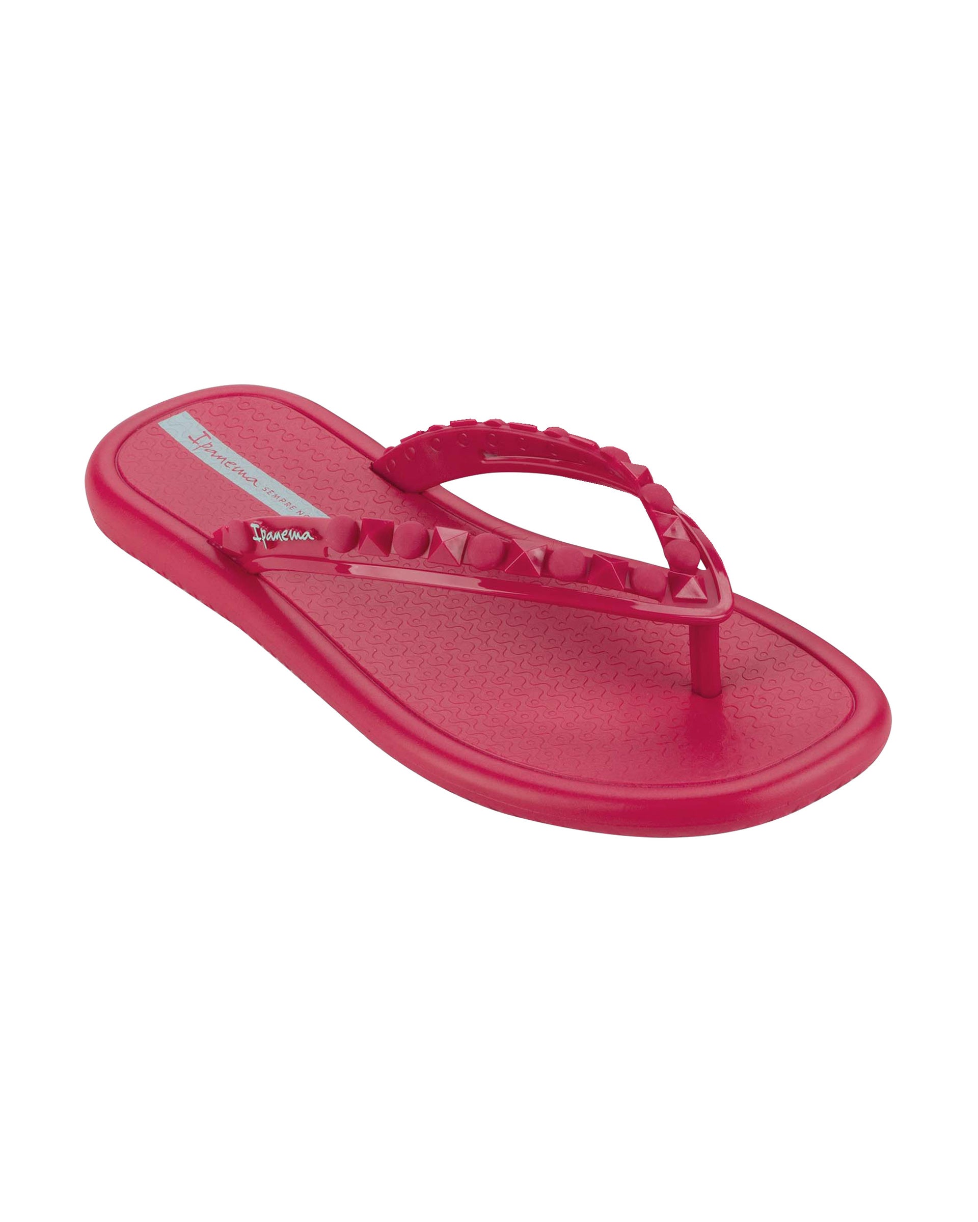 Angled view of a dark pink Ipanema Meu Sol women's flip flop with stud details on strap.