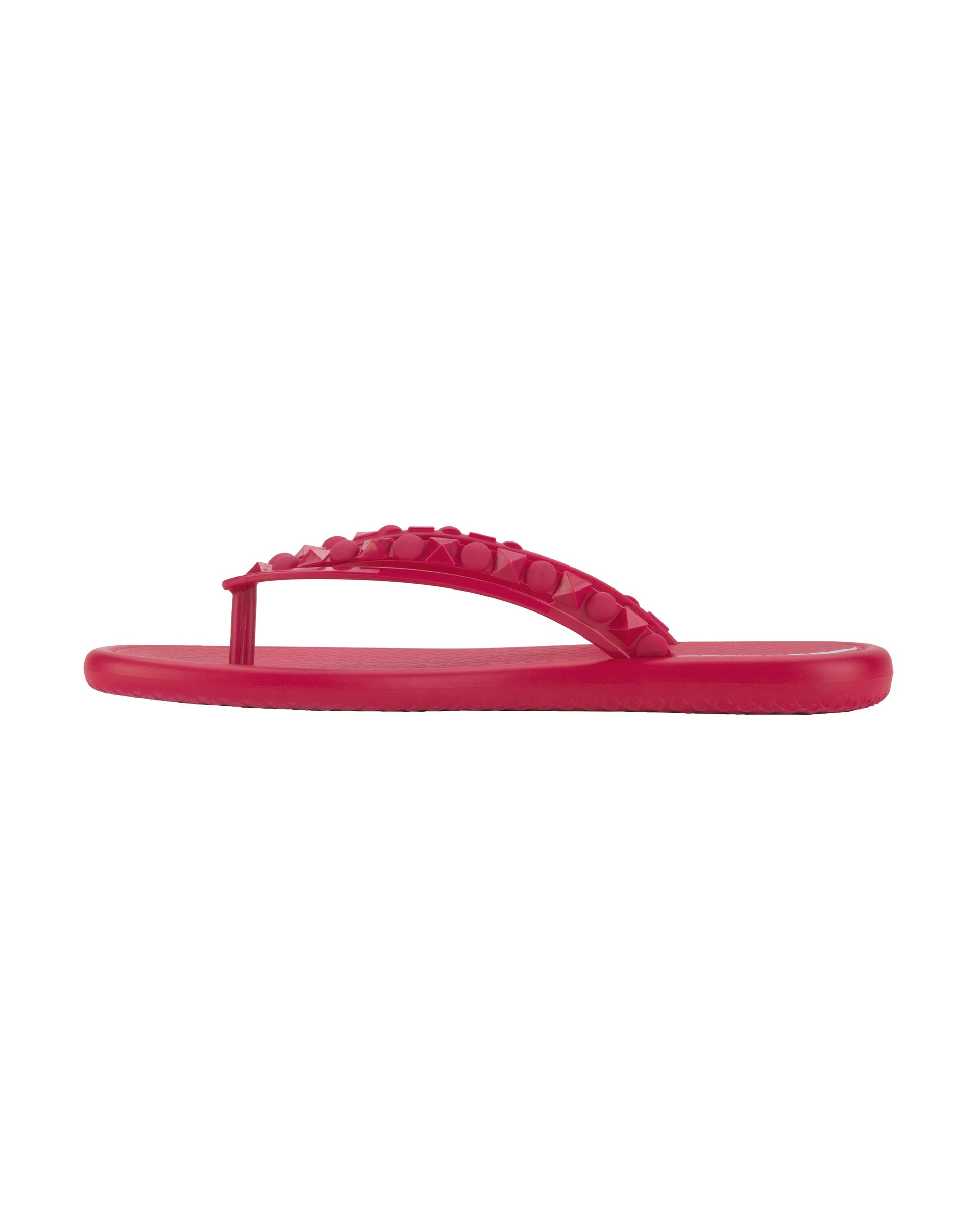 Side view of a dark pink Ipanema Meu Sol women's flip flop with stud details on strap.
