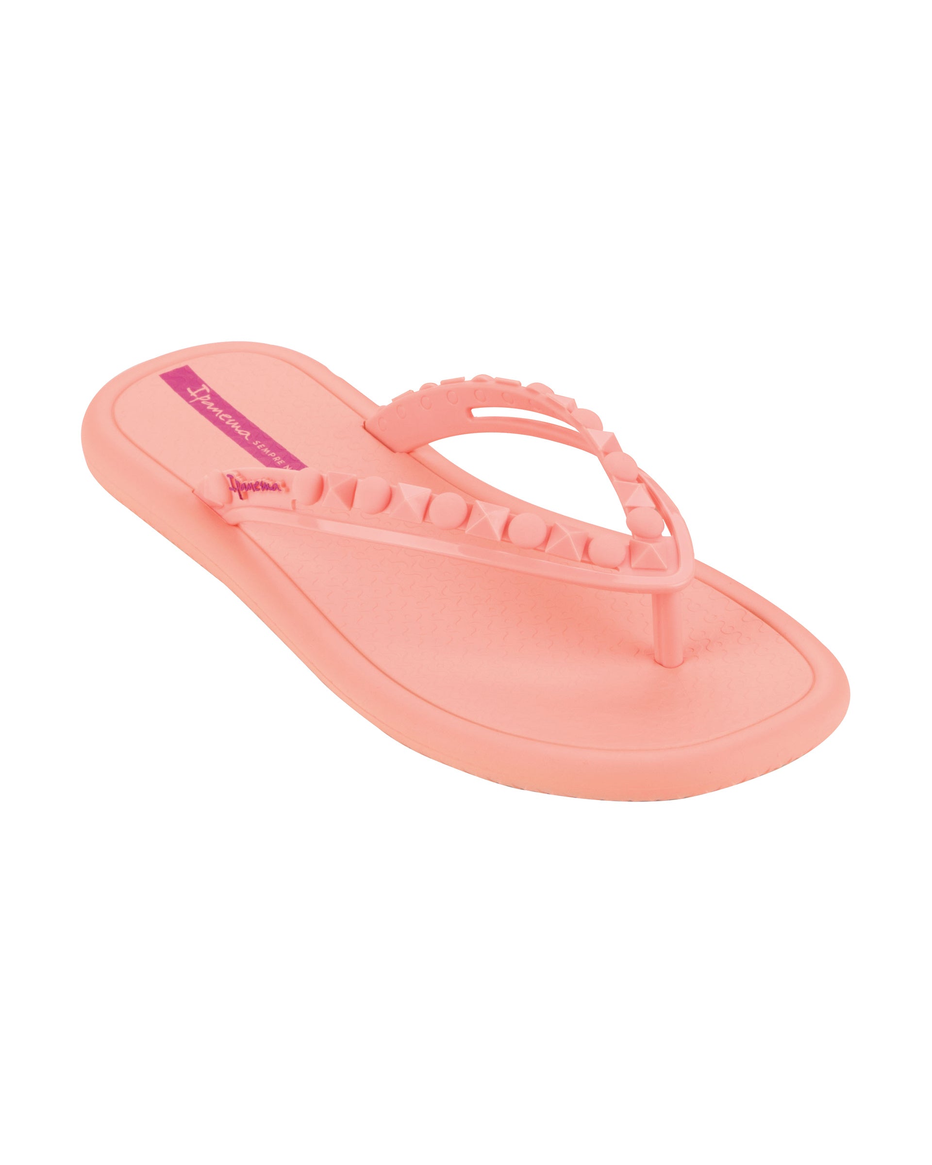 Angled view of a light pink Ipanema Meu Sol women's flip flop with stud details on strap.