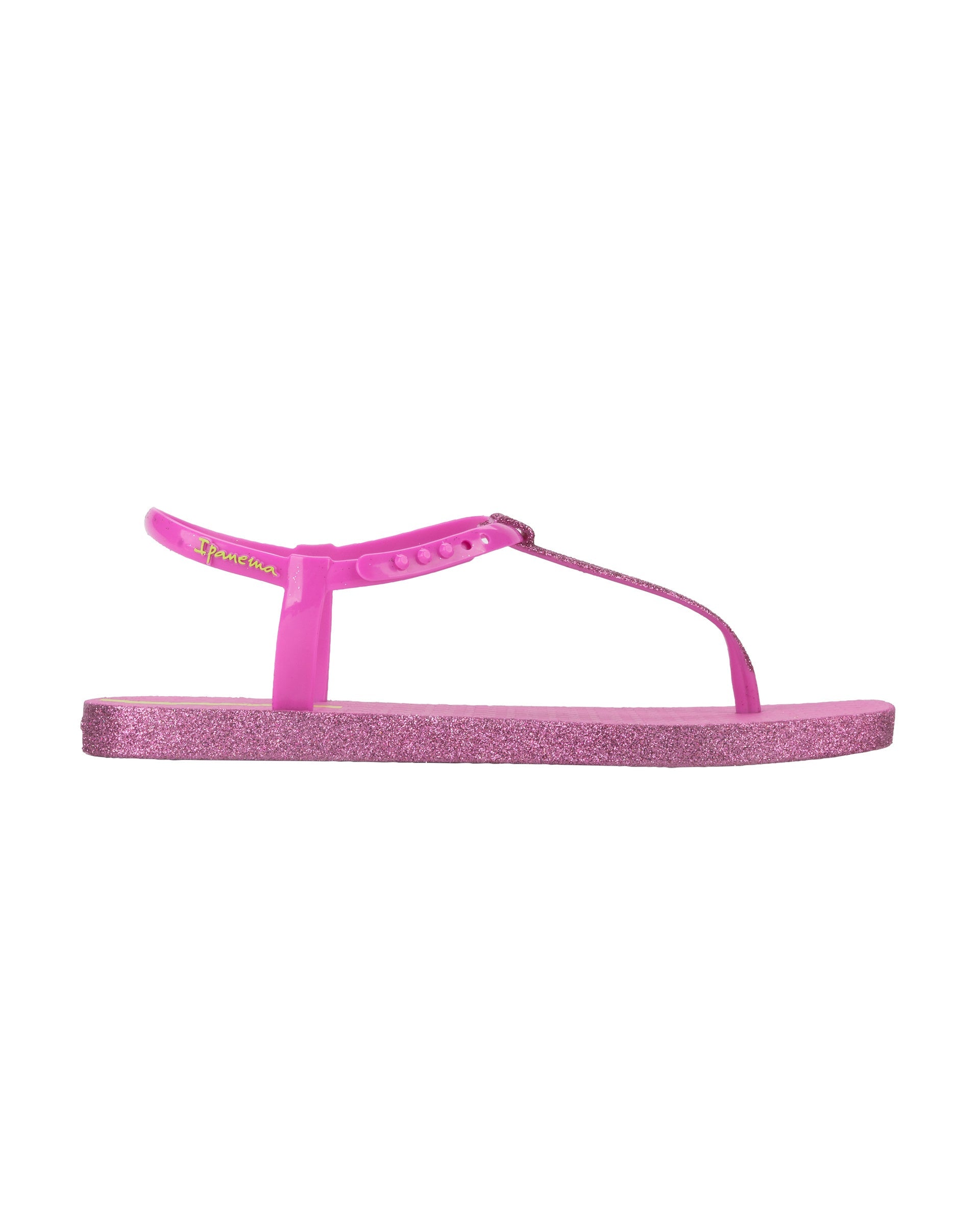 Outer side view of a pink Ipanema Class Edge Glow t-strap women's sandal with glitter pink thong.