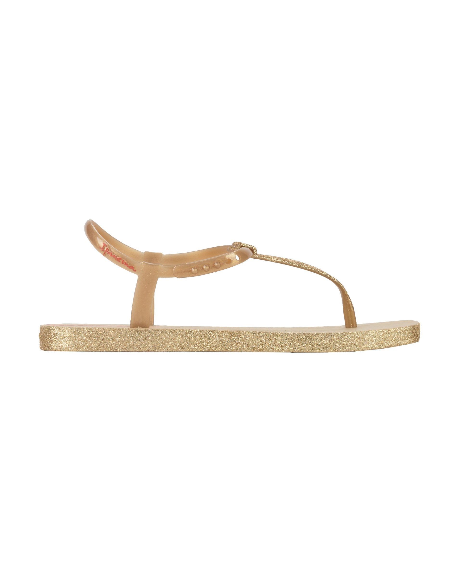 Outer side view of a beige Ipanema Class Edge Glow t-strap women's sandal with gold strap and glitter thong.