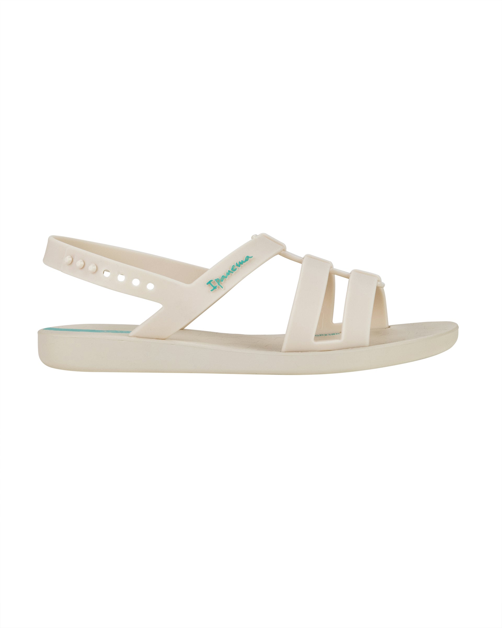 Outer side view of a beige Ipanema Class Go women's sandal.