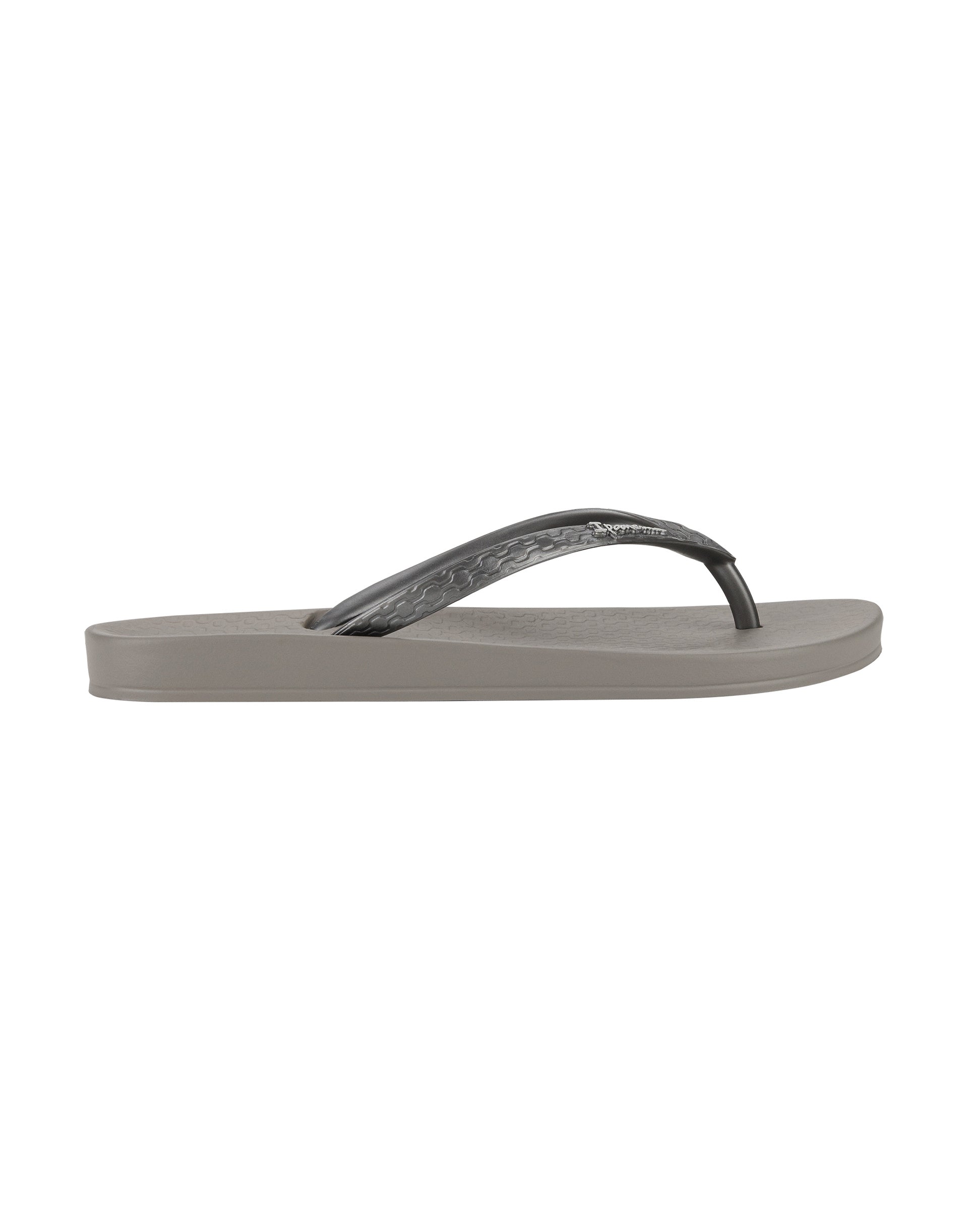 Outer side view of a grey Ipanema Ana Tan women's flip flop.