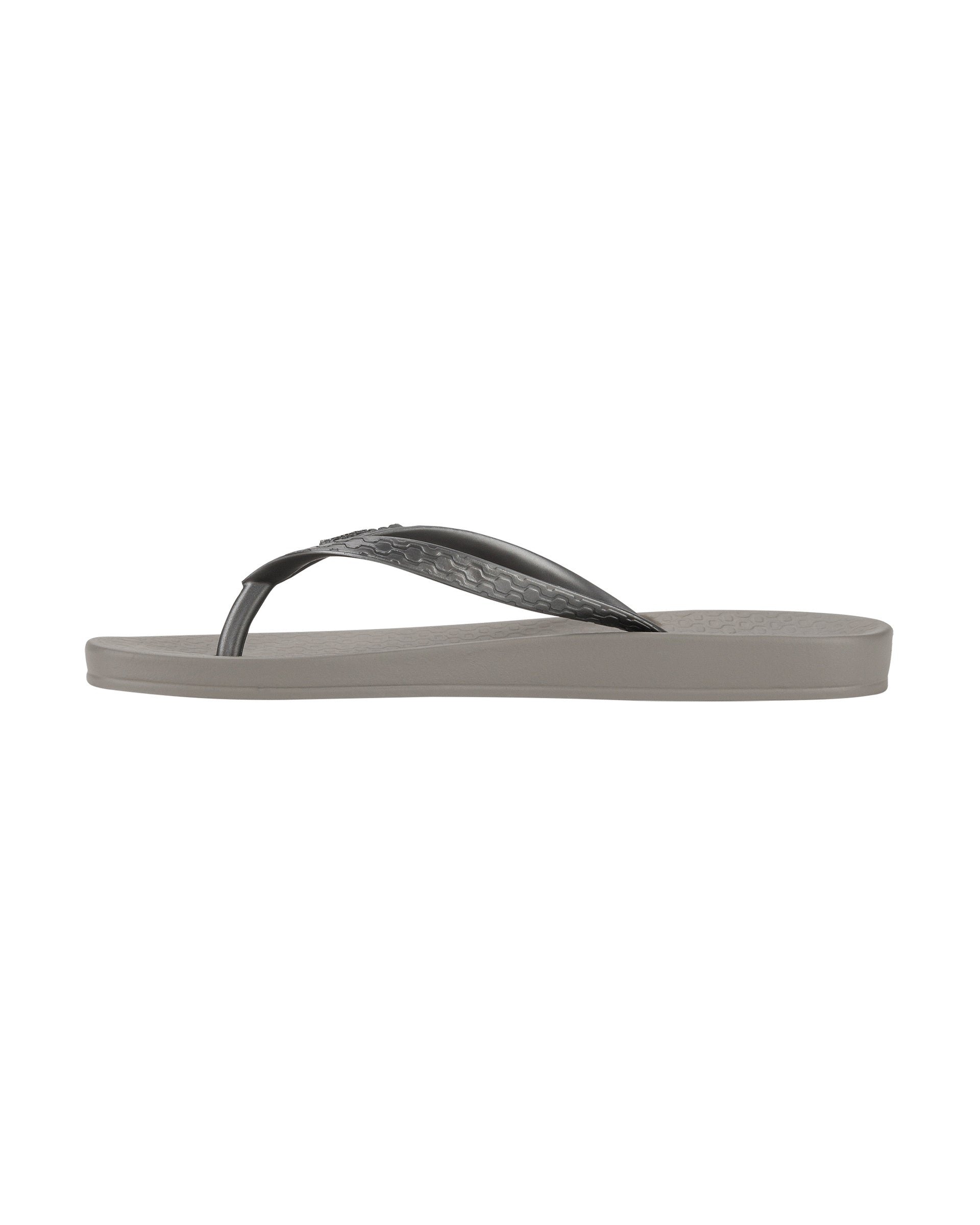 Inner side view of a grey Ipanema Ana Tan women's flip flop.