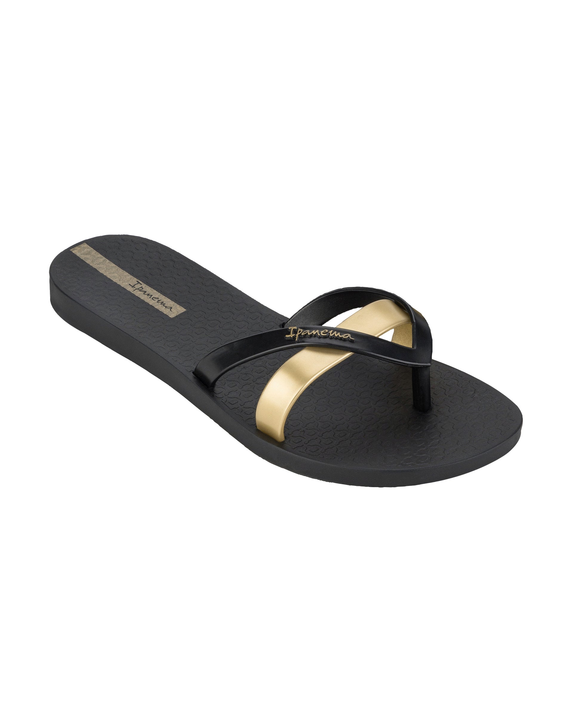 Angled view of a black and gold Ipanema Kirei women's flip flop.
