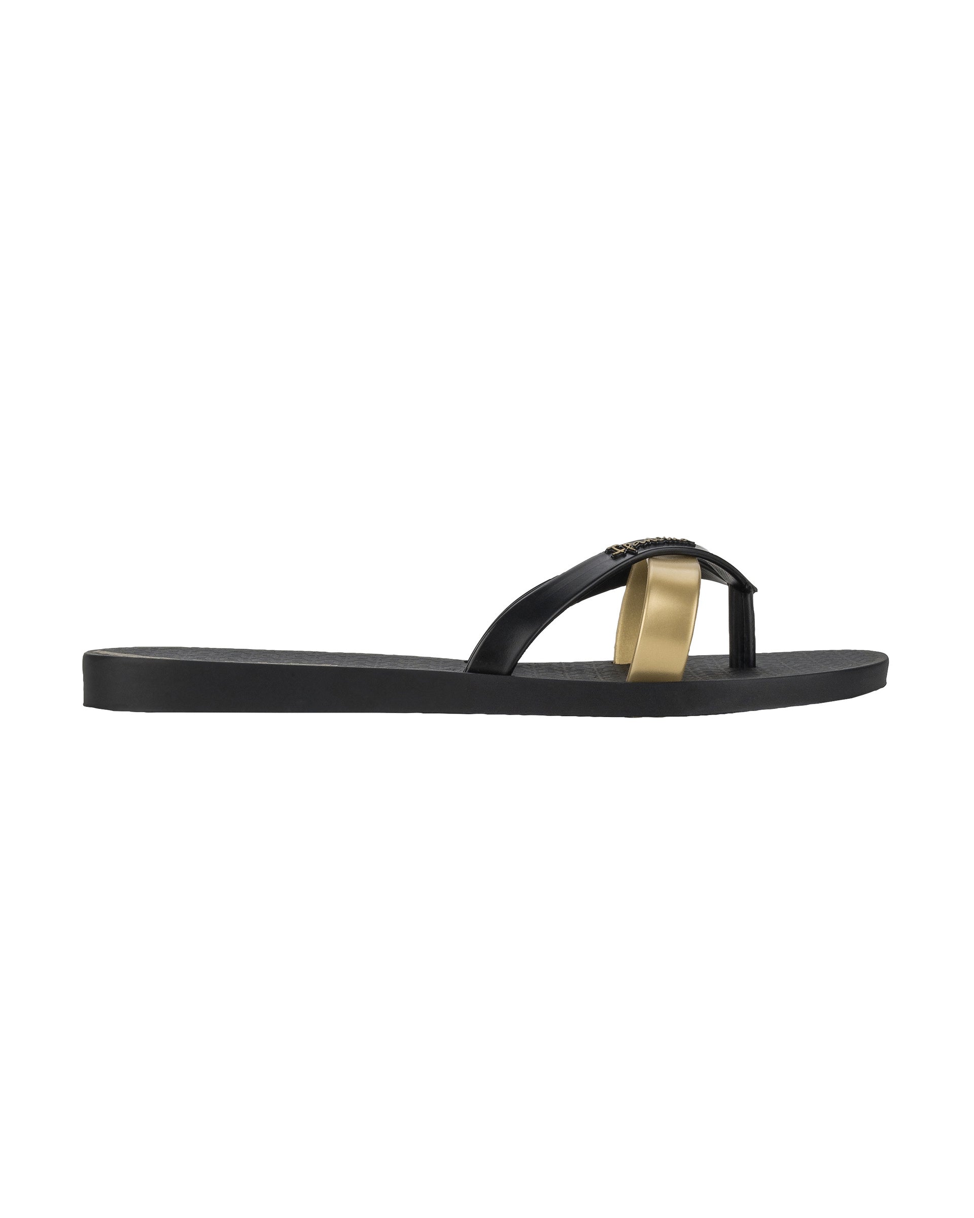 Side view of a black and gold Ipanema Kirei women's flip flop.