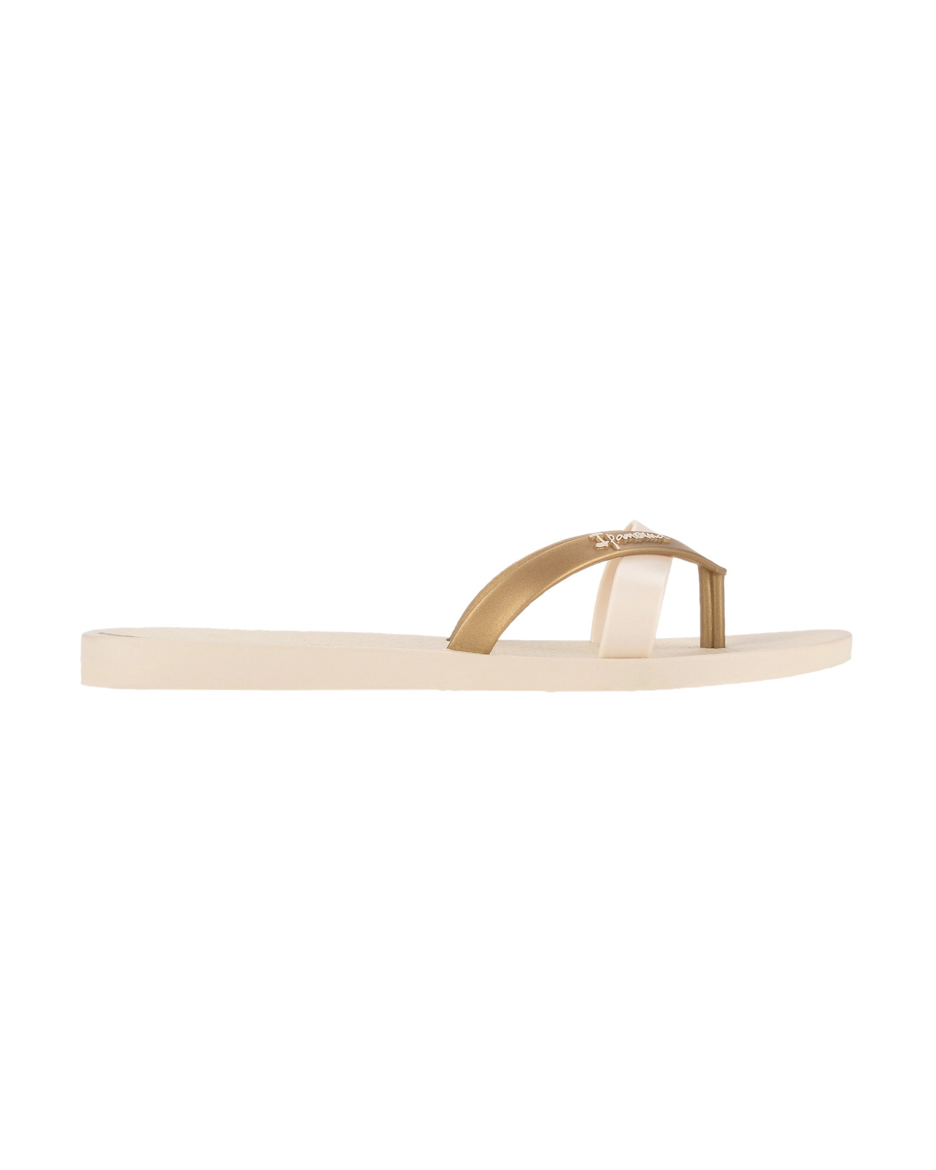 Side view of a beige and gold Ipanema Kirei women's flip flop.