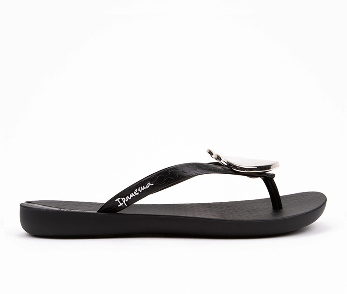 Side view of a black Ipanema Wave Heart flip flops with a silver heart.