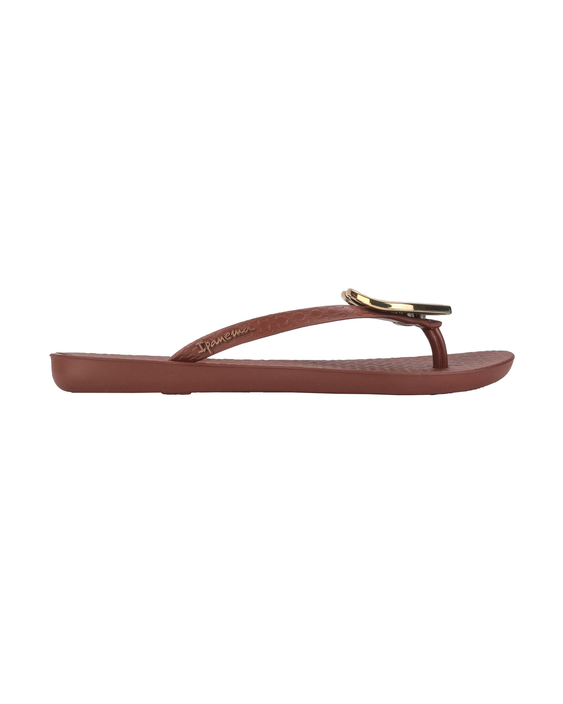 Outer side view of a brown Ipanema Wave Heart women's flip flop with gold heart.