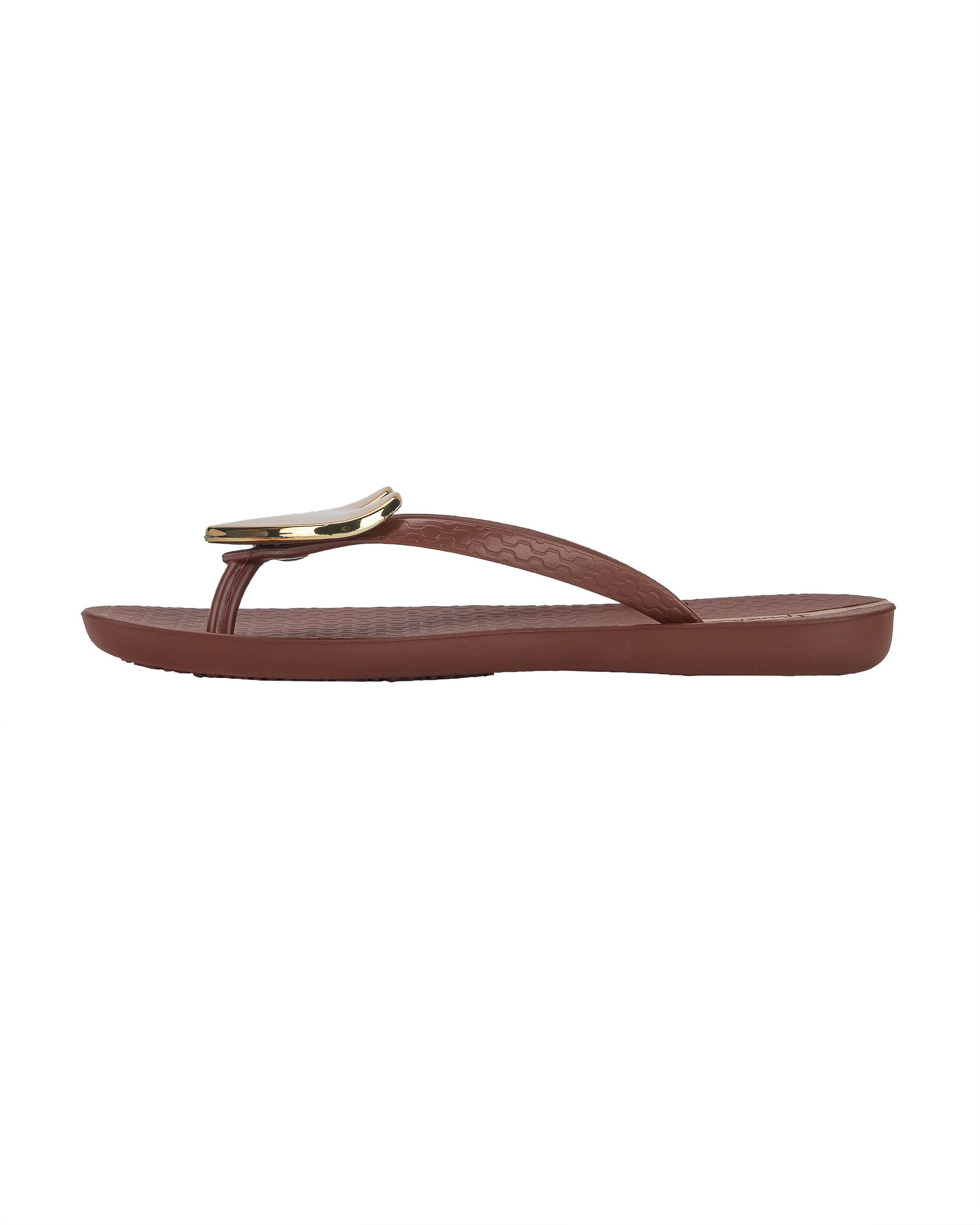 Inner side view of a brown Ipanema Wave Heart women's flip flop with gold heart.