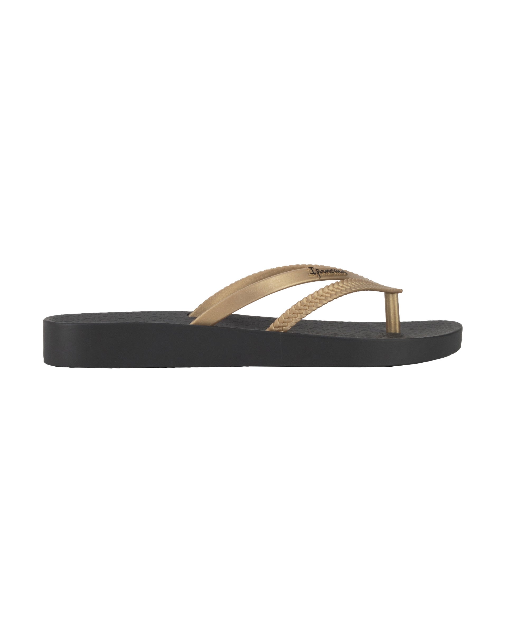Outer side view of a black Ipanema Bossa Soft women's flip flop with metallic gold straps.