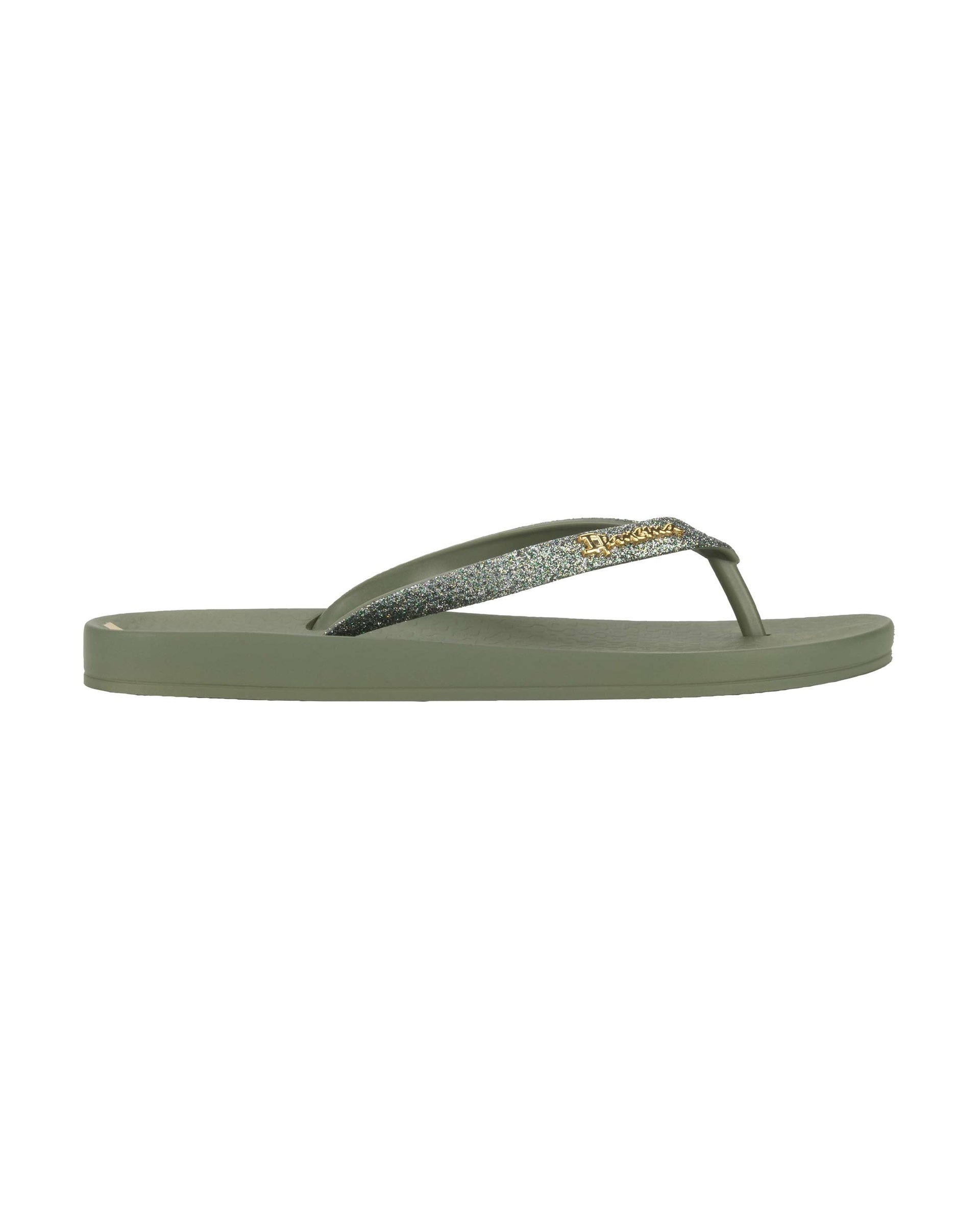 Outer side view of a green Ipanema Ana Sparkle women's flip flop with glitter green straps.