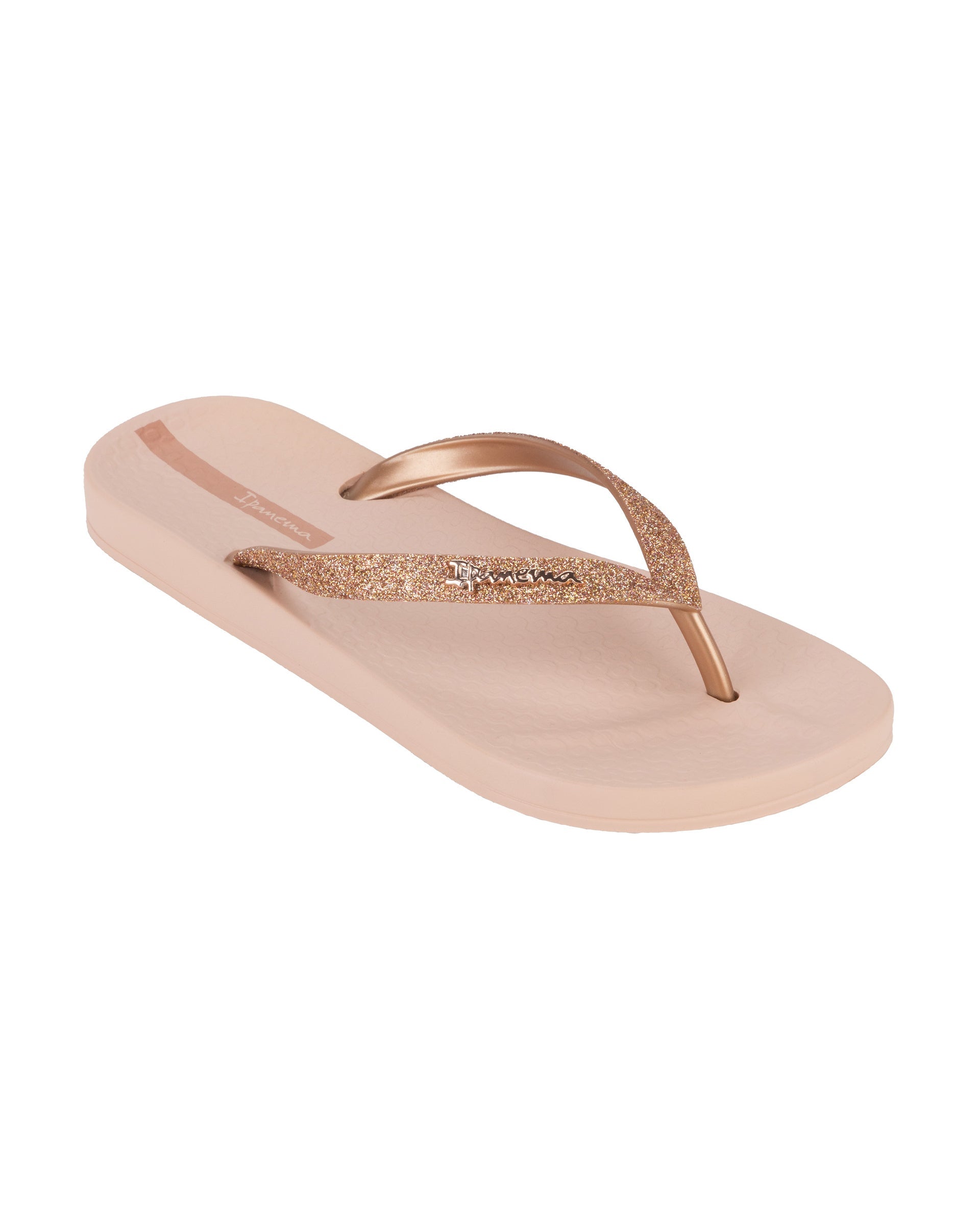 Angled view of a pink Ipanema Ana Sparkle women's flip flop with glitter rose gold straps.