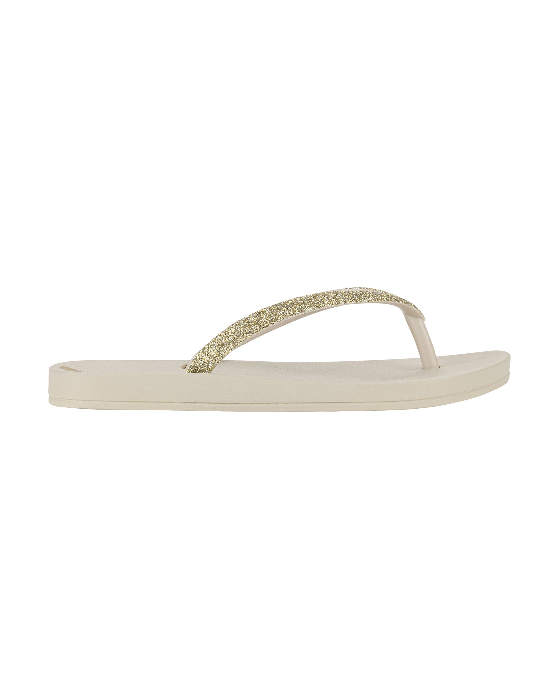 Outer side view of a beige Ipanema Ana Sparkle kids flip flop with gold glitter strap.