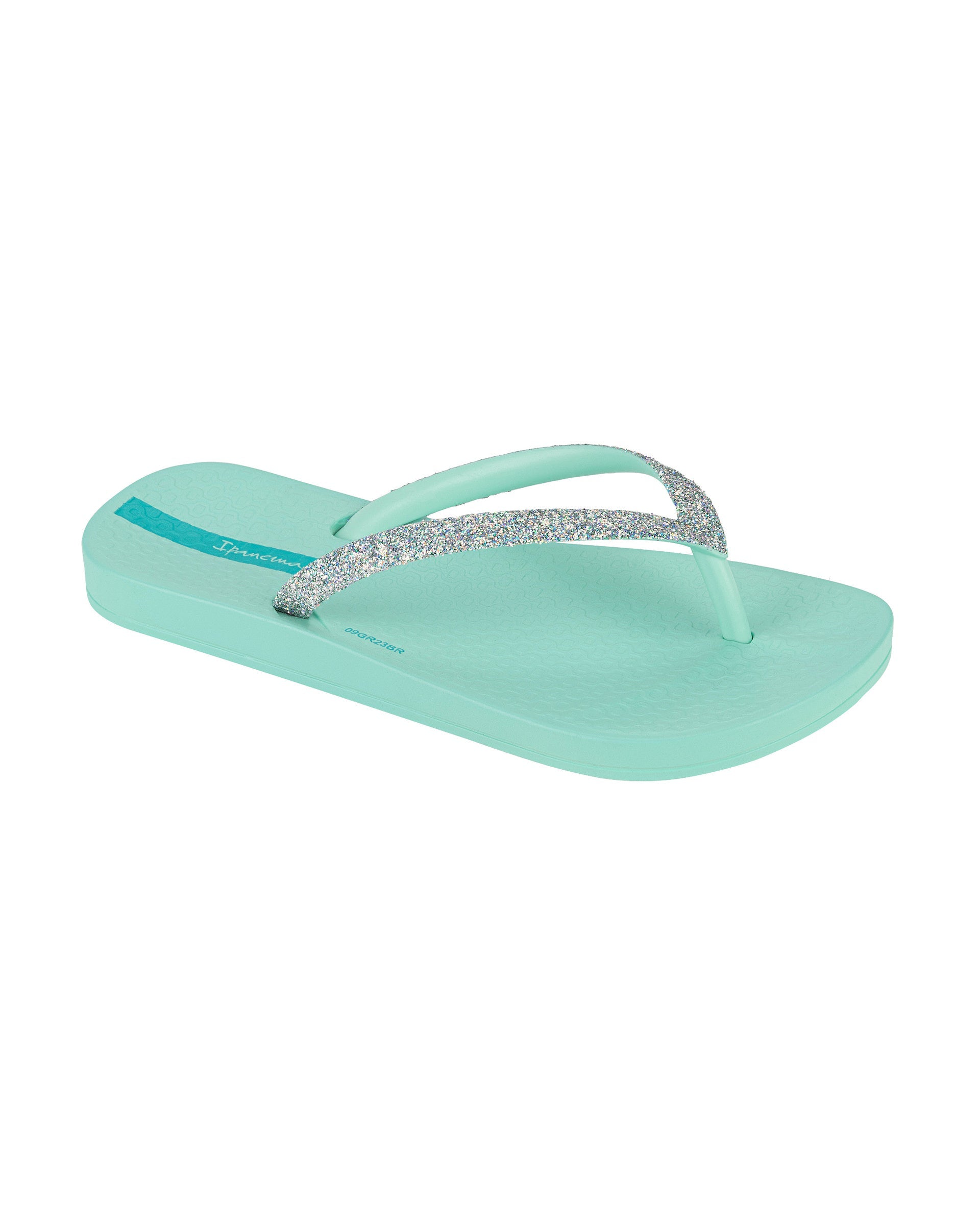 Angled view of a green Ipanema Ana Sparkle kids flip flop with silver glitter strap.