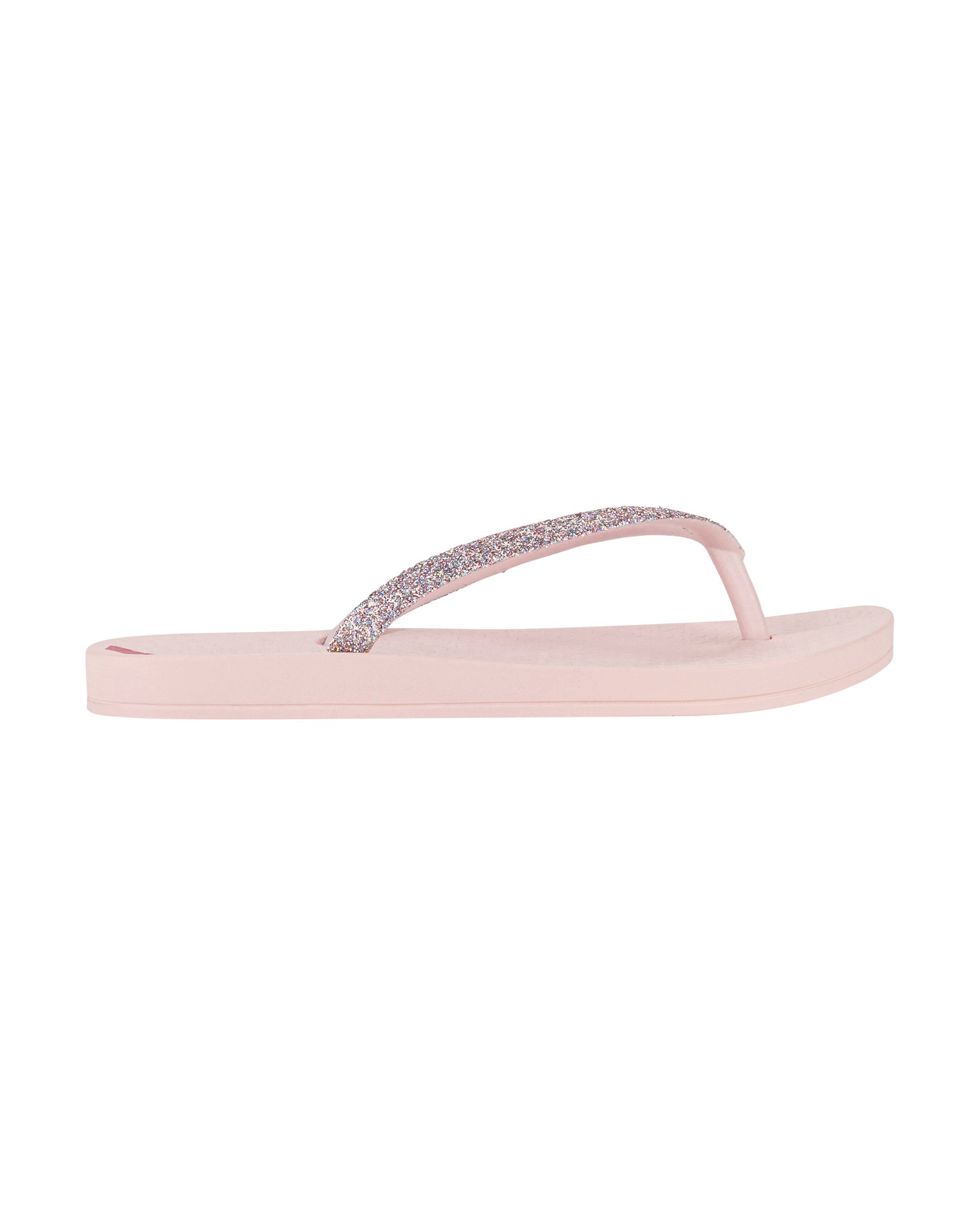 Outer side view of a pink Ipanema Ana Sparkle kids flip flop with multicolor glitter strap.