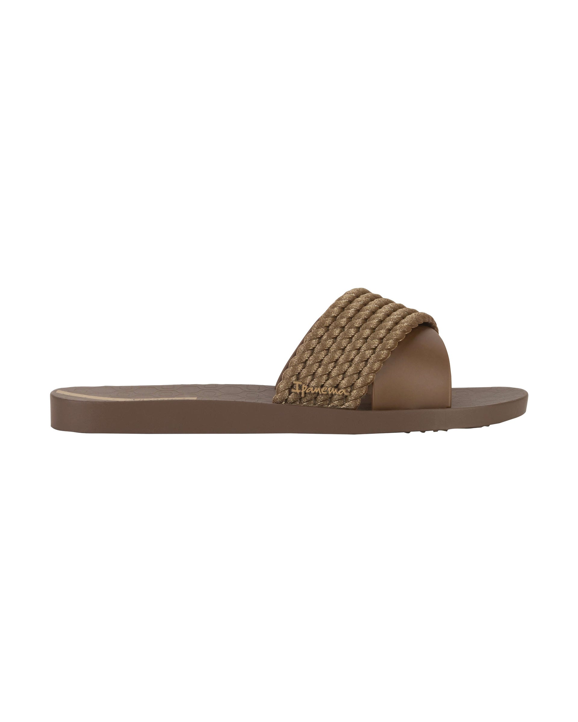Outer side view of a brown Ipanema Street women's slide.