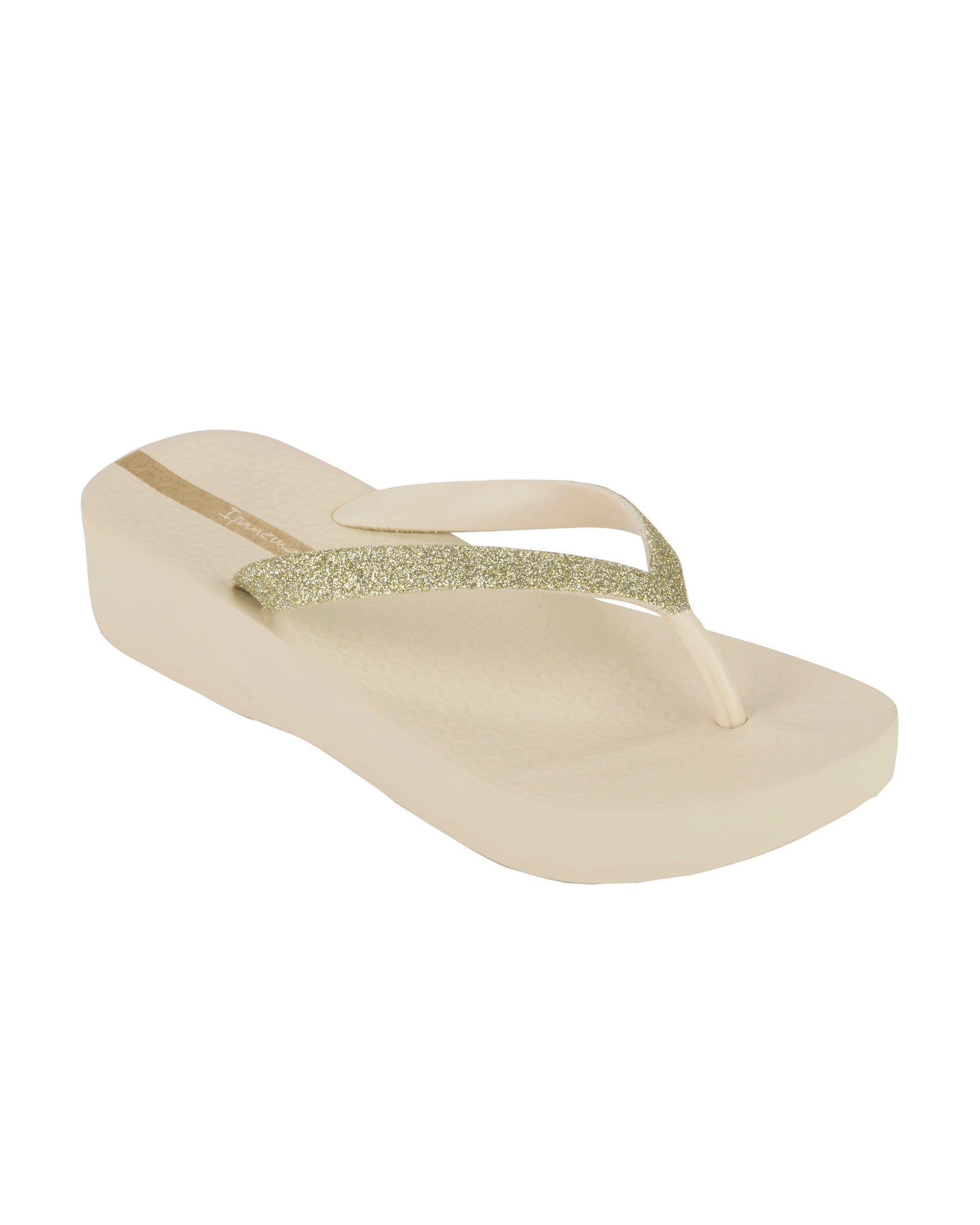 Angled view of a beige Ipanema Mesh Chic women's wedge flip flop with glitter gold straps.