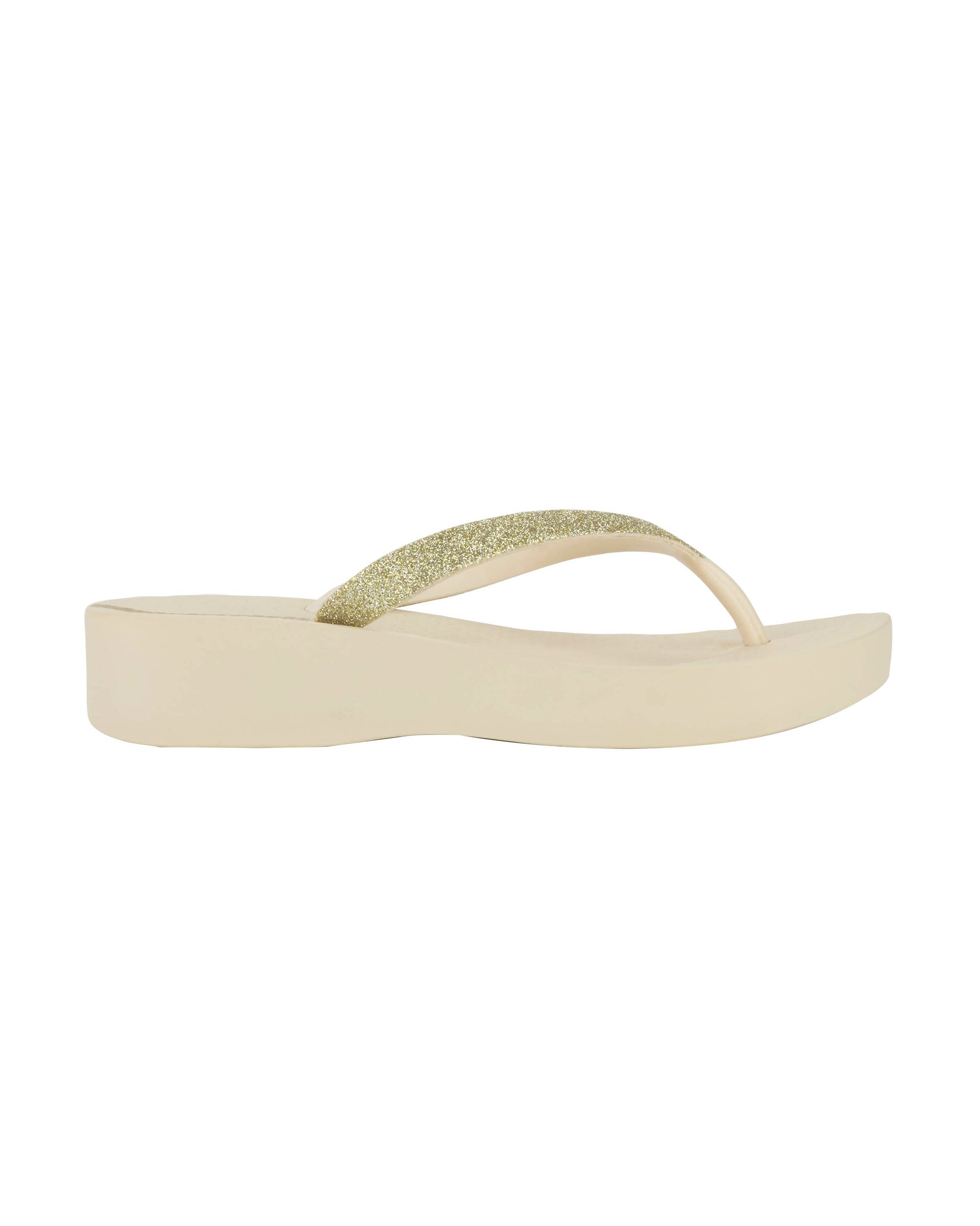 Outer side view of a beige Ipanema Mesh Chic women's wedge flip flop with glitter gold straps.