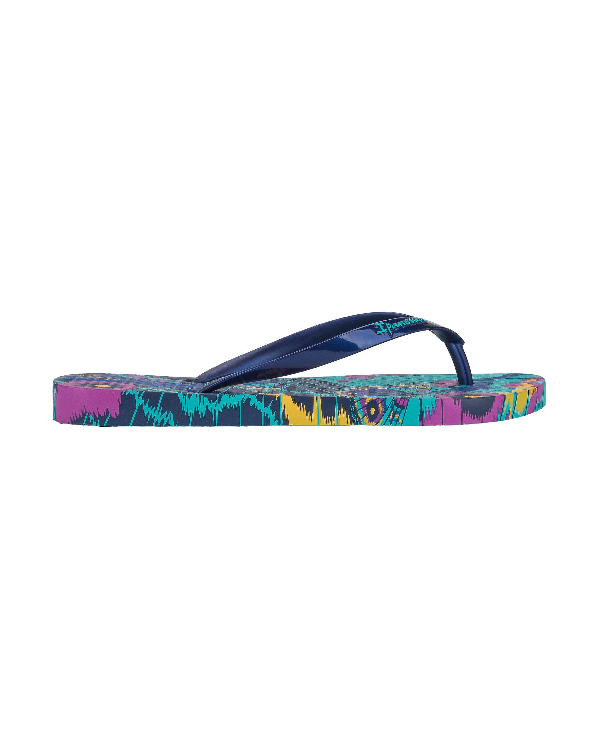 Outer side view of a blue Ipanema Animal Print women's flip flop with glitter blue straps and butterfly sole print.