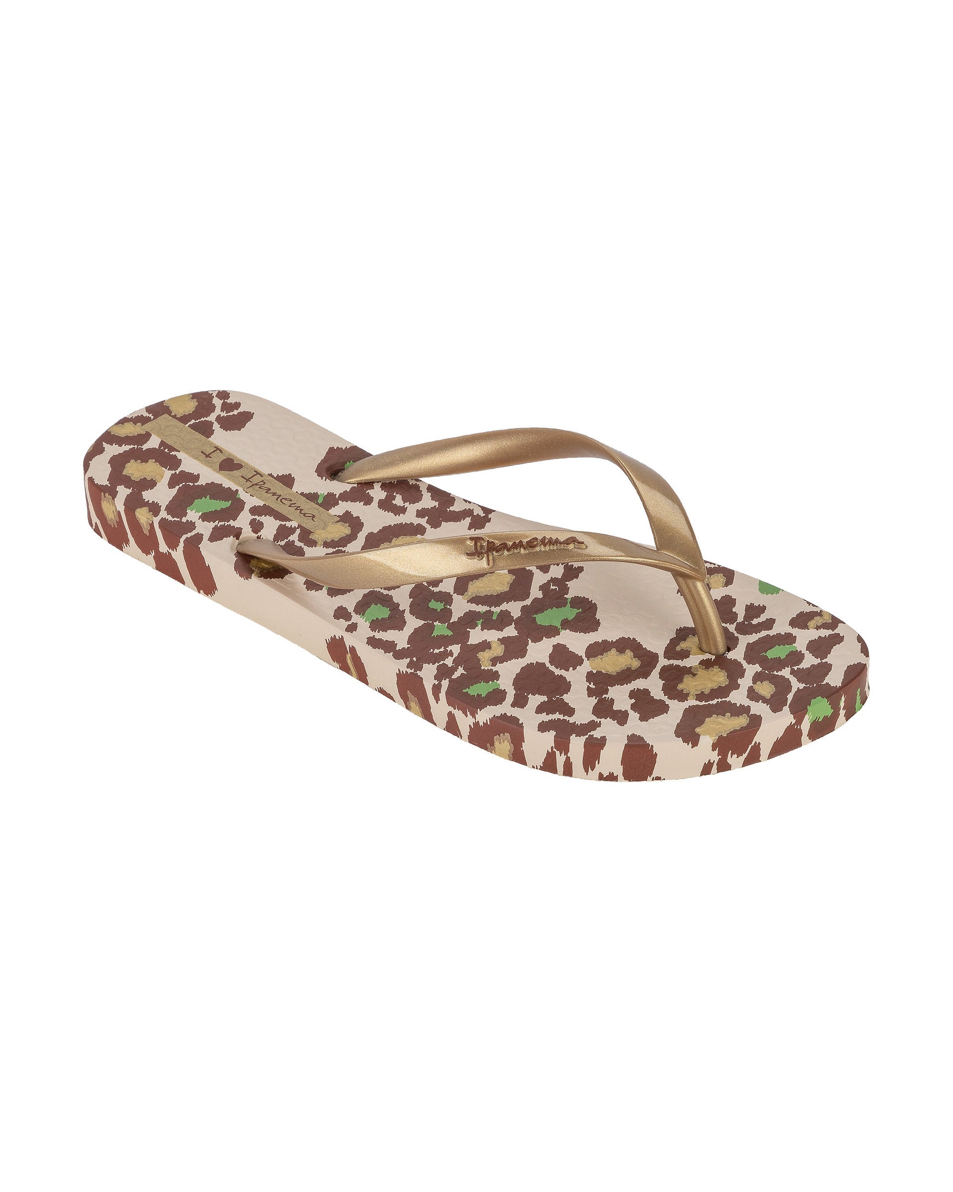 Angled view of a beige Ipanema Animal Print women's flip flop with glitter gold straps and leopard sole print.