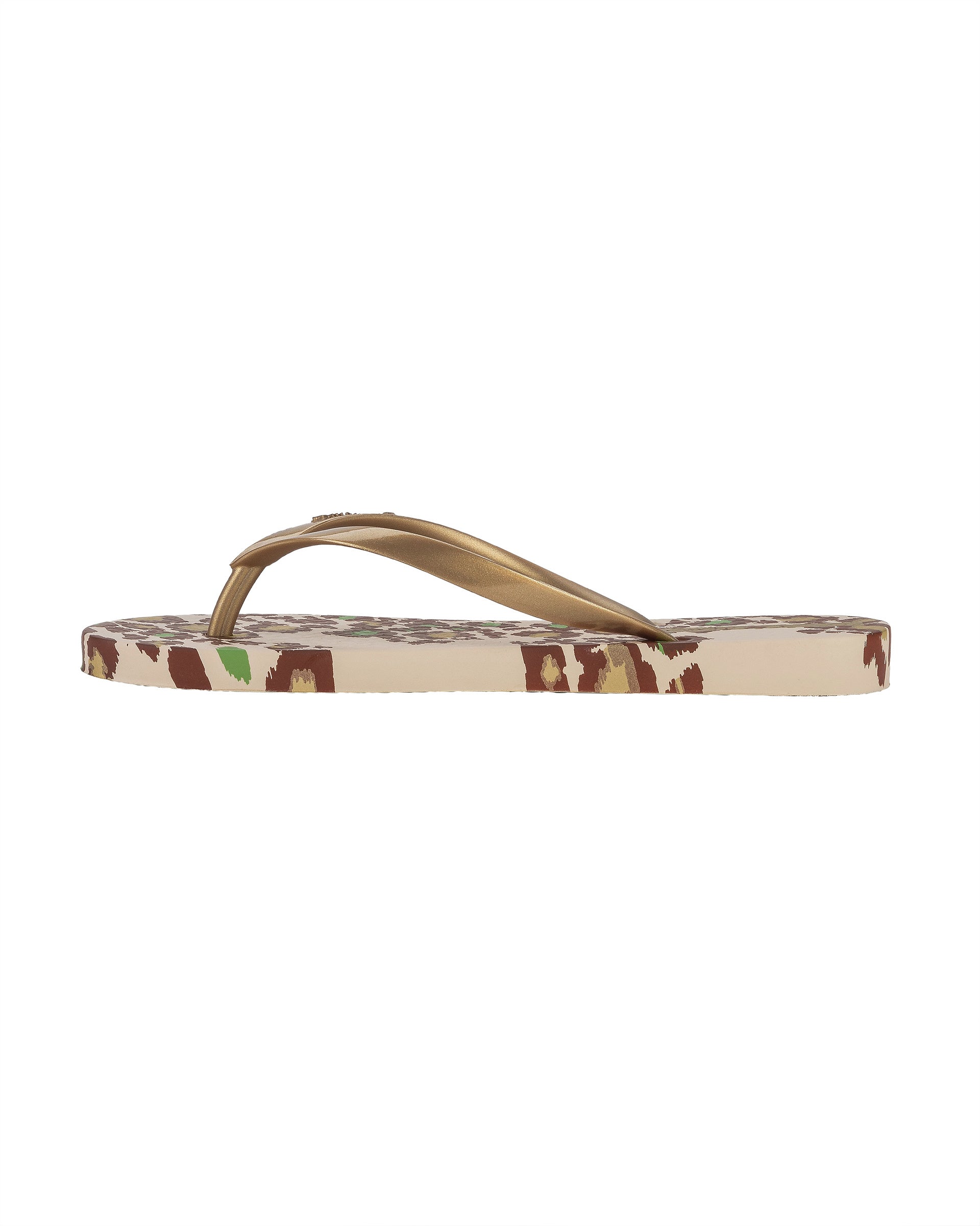 Inner side view of a beige Ipanema Animal Print women's flip flop with glitter gold straps and leopard sole print.