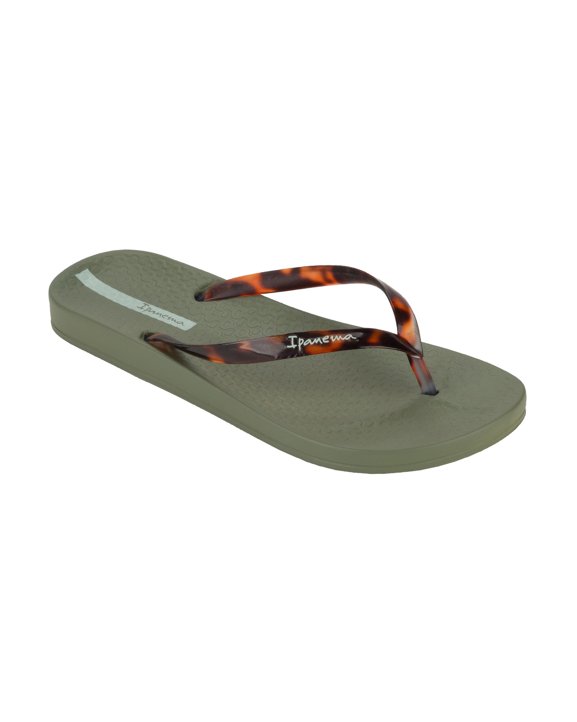 Angled view of a green Ipanema Ana Connect women's flip flop with brown tortoiseshell  color strap.