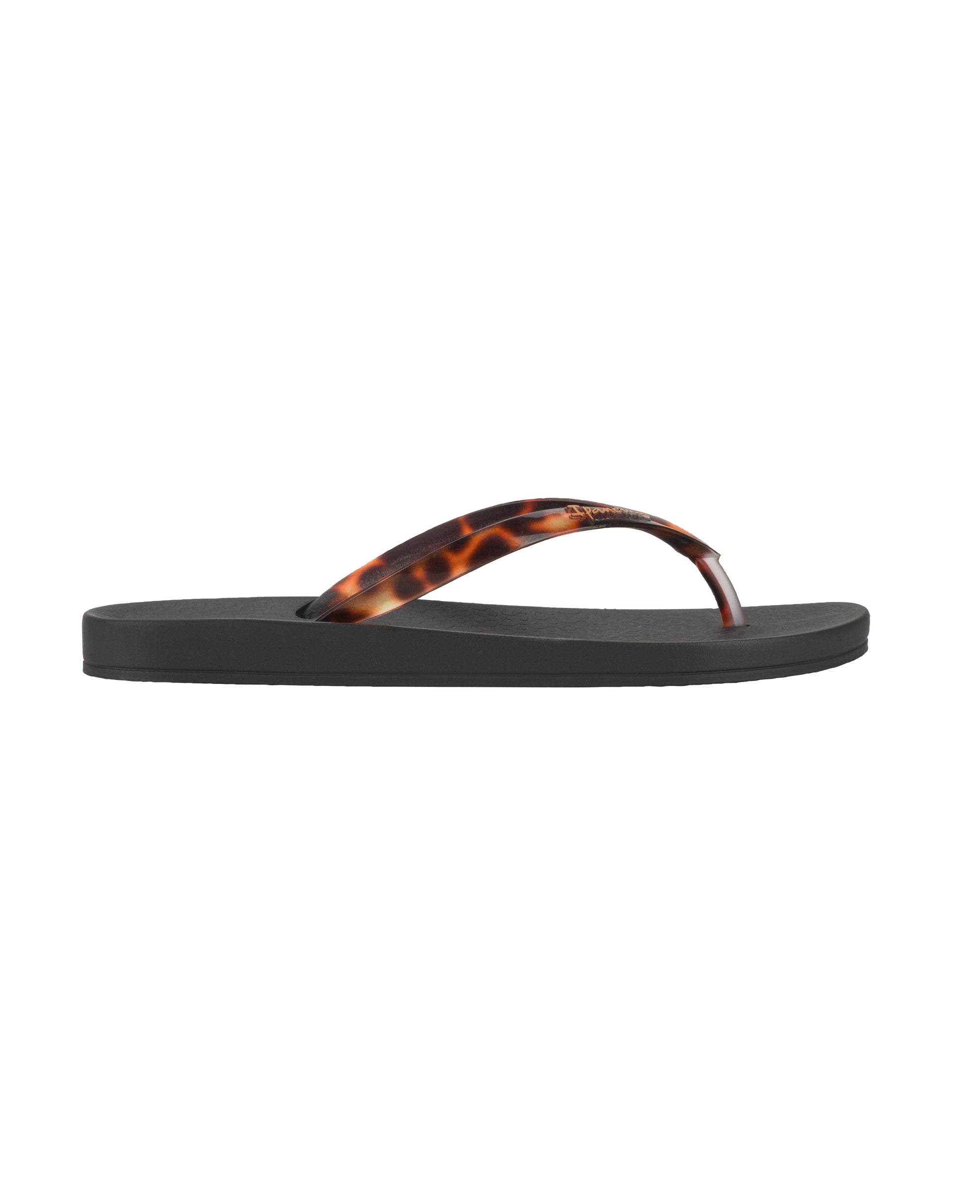 Outer side view of a black Ipanema Ana Connect women's flip flop with brown tortoiseshell  color strap.