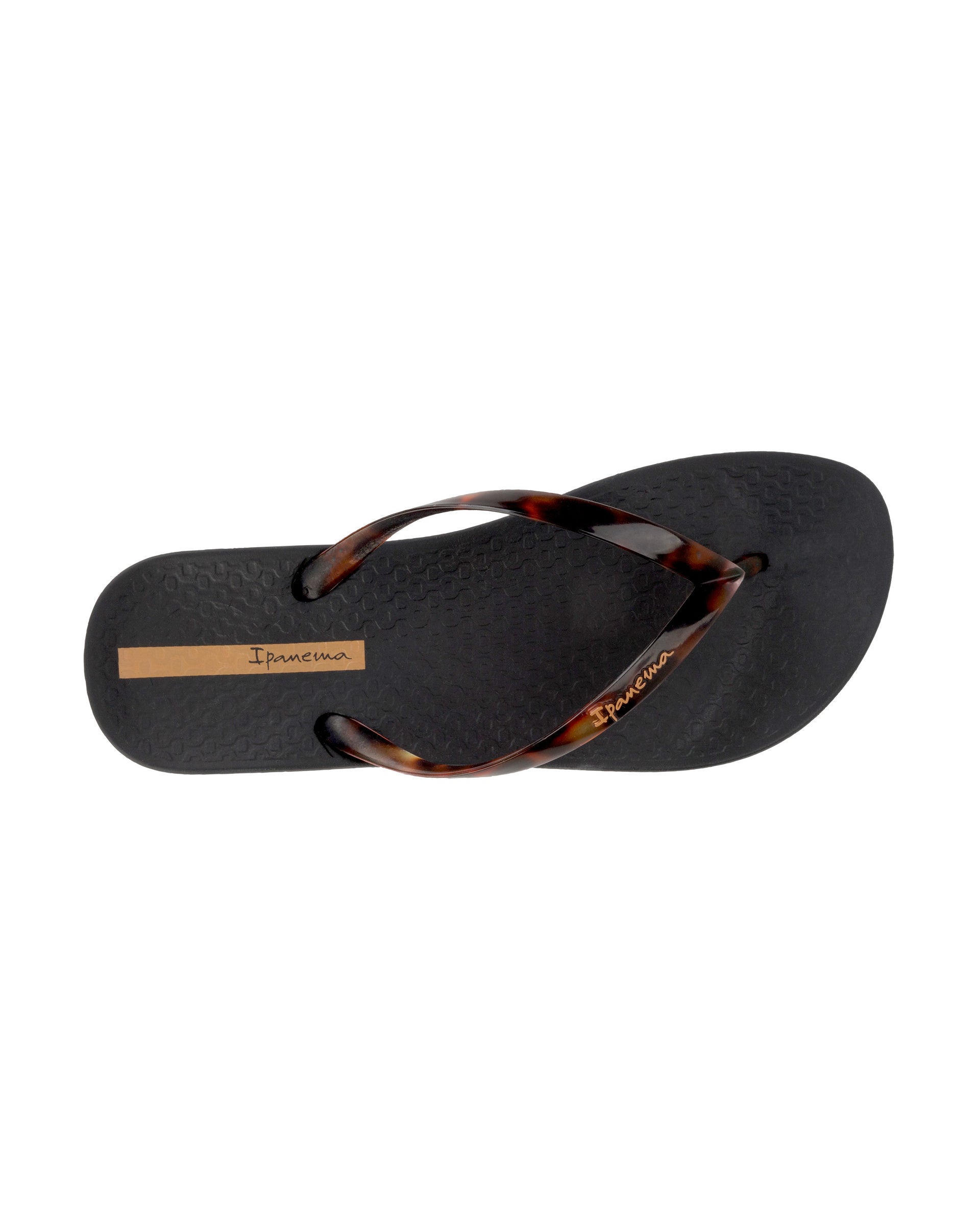Top view of a black Ipanema Ana Connect women's flip flop with brown tortoiseshell  color strap.