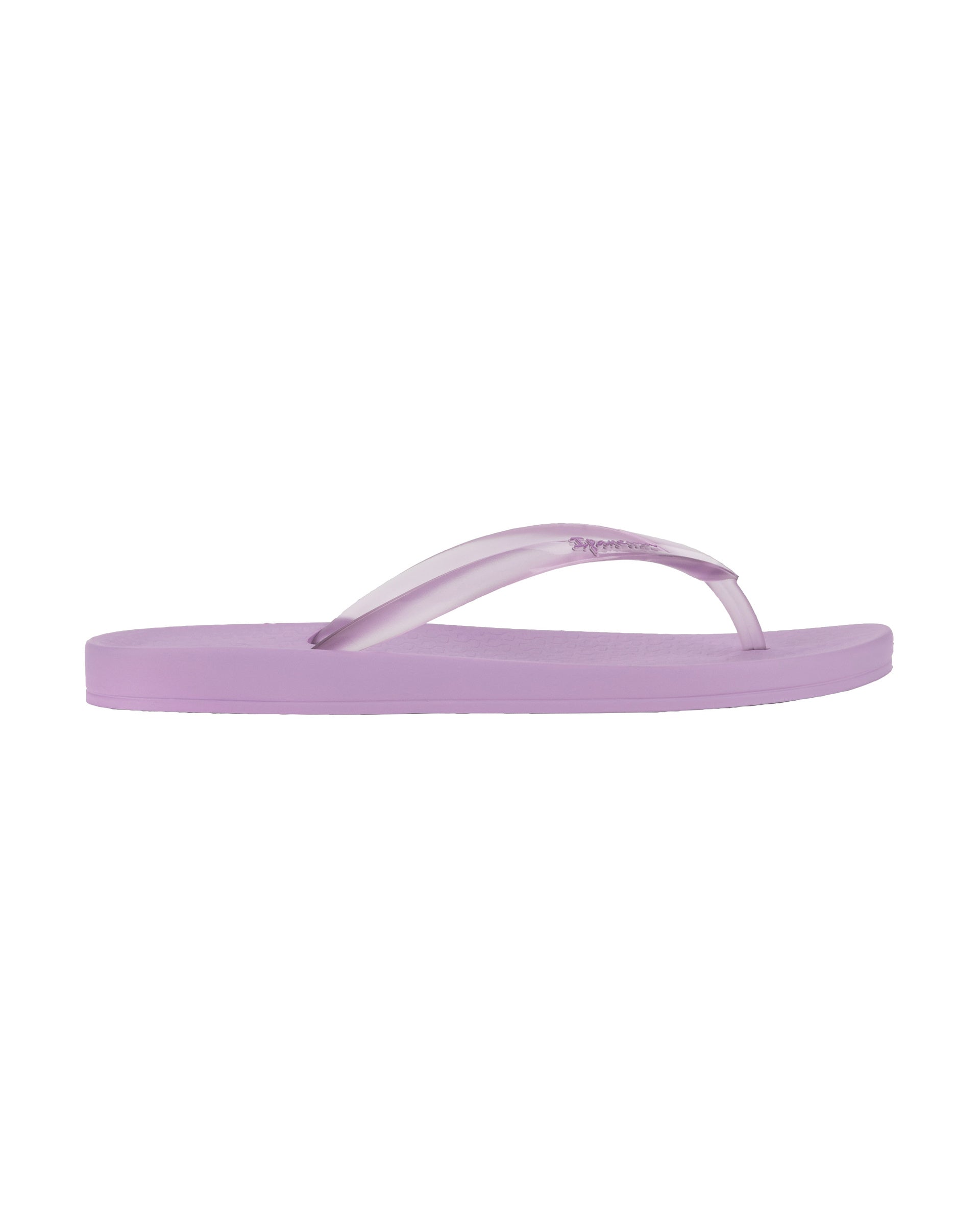 Outer side view of a purple Ipanema Ana Connect women's flip flop with a clear purple strap.