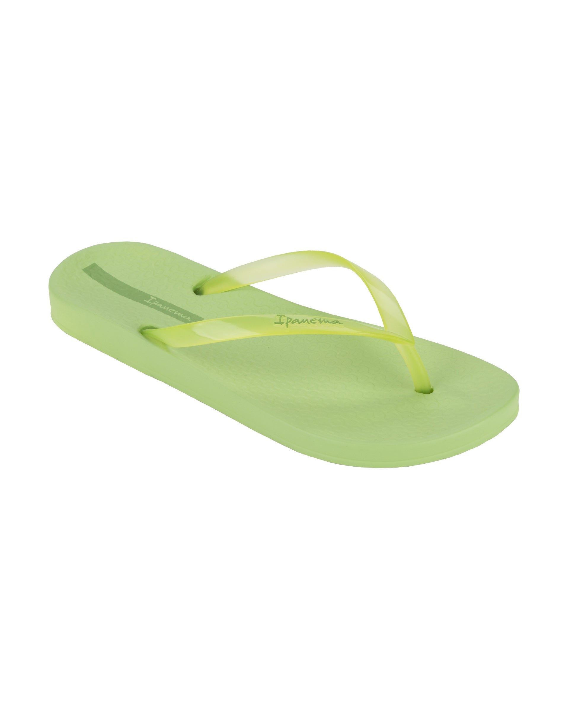 Angled view of a green Ipanema Ana Connect women's flip flop with a clear green strap.