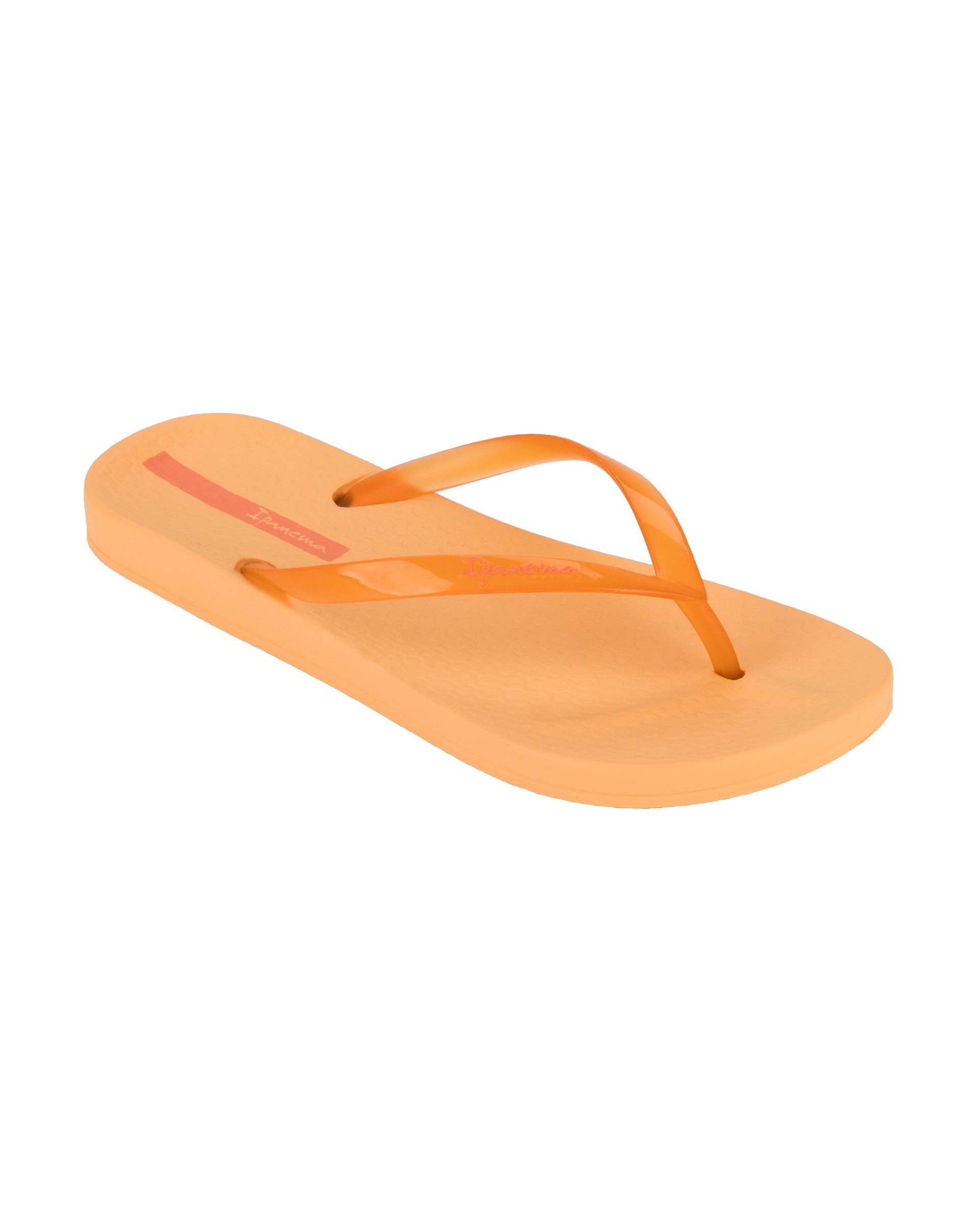 Angled view of a orange Ipanema Ana Connect women's flip flop with a clear orange strap.