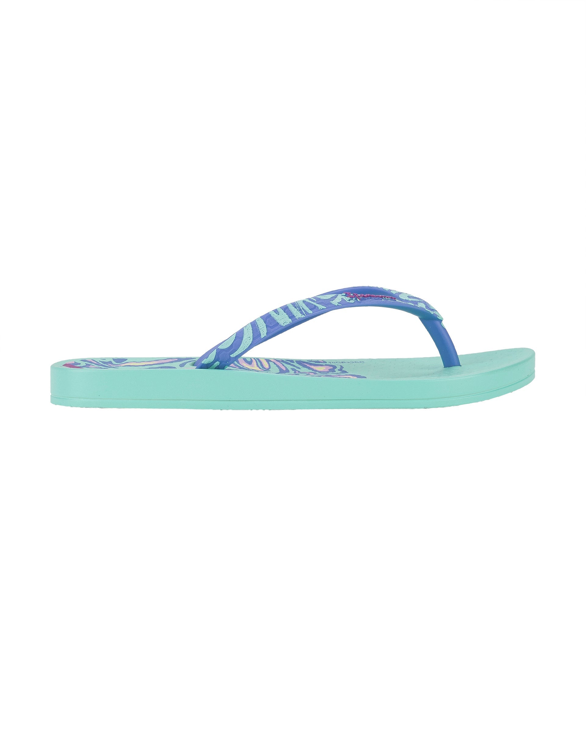 Outer side view of a green Ipanema Nostalgic Hearts kid's flip flop with heart outlines on insole and blue strap.