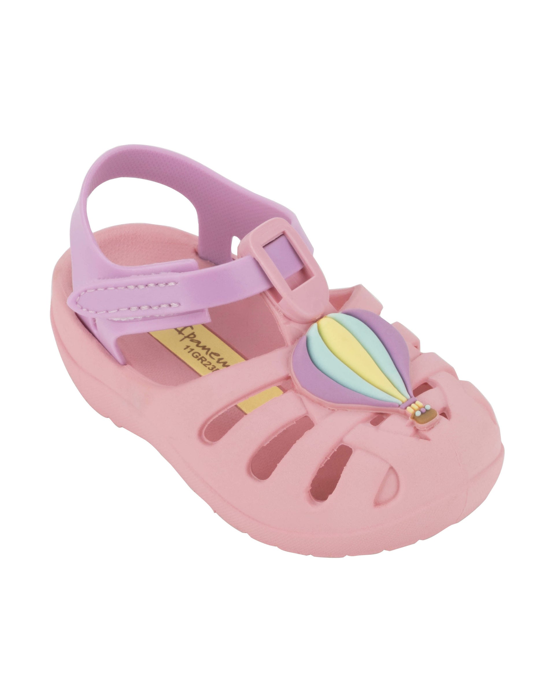 Angled view of a pink Ipanema Summer baby sandal with hot air balloon on the upper.