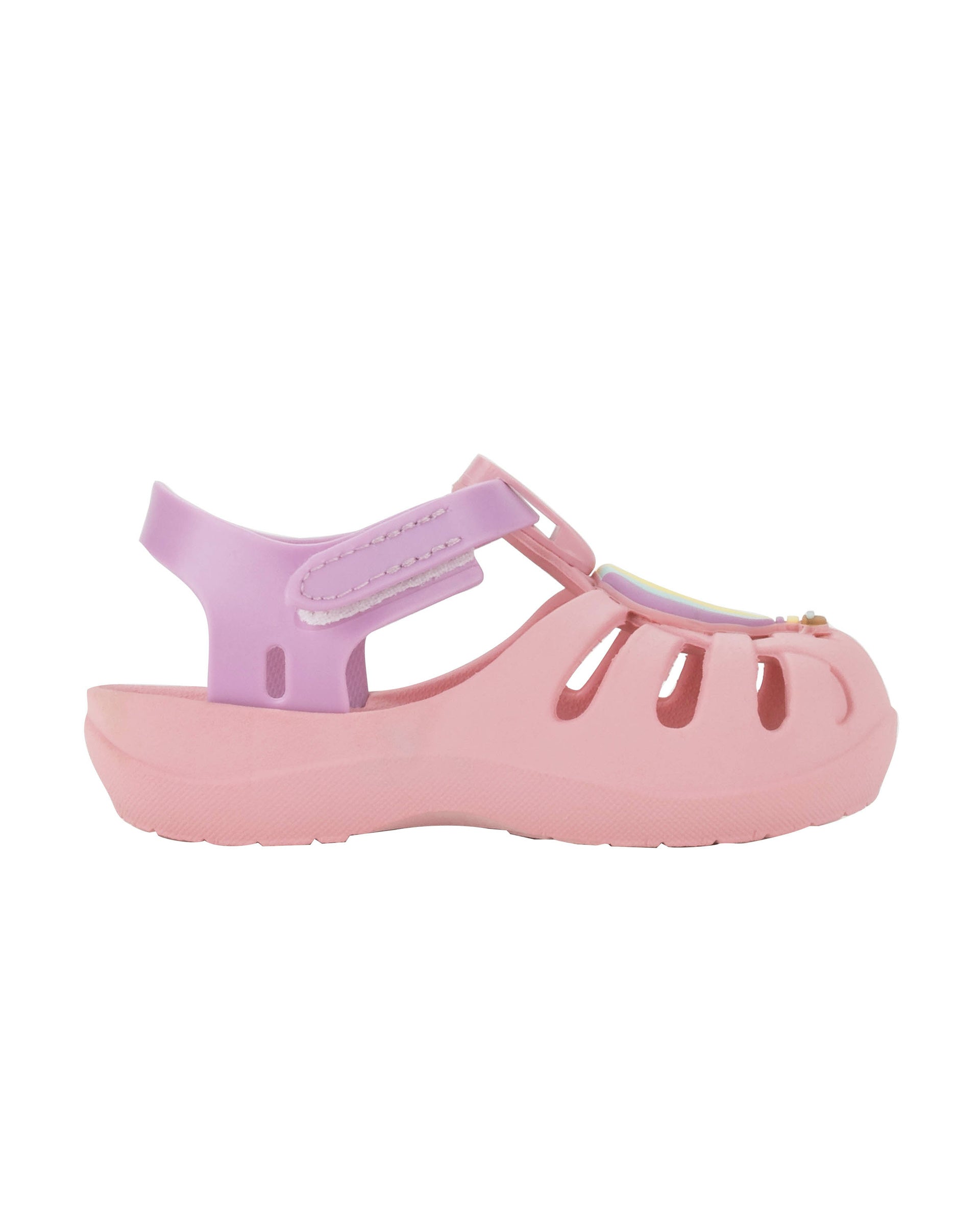 Outer side view of a pink Ipanema Summer baby sandal with hot air balloon on the upper.
