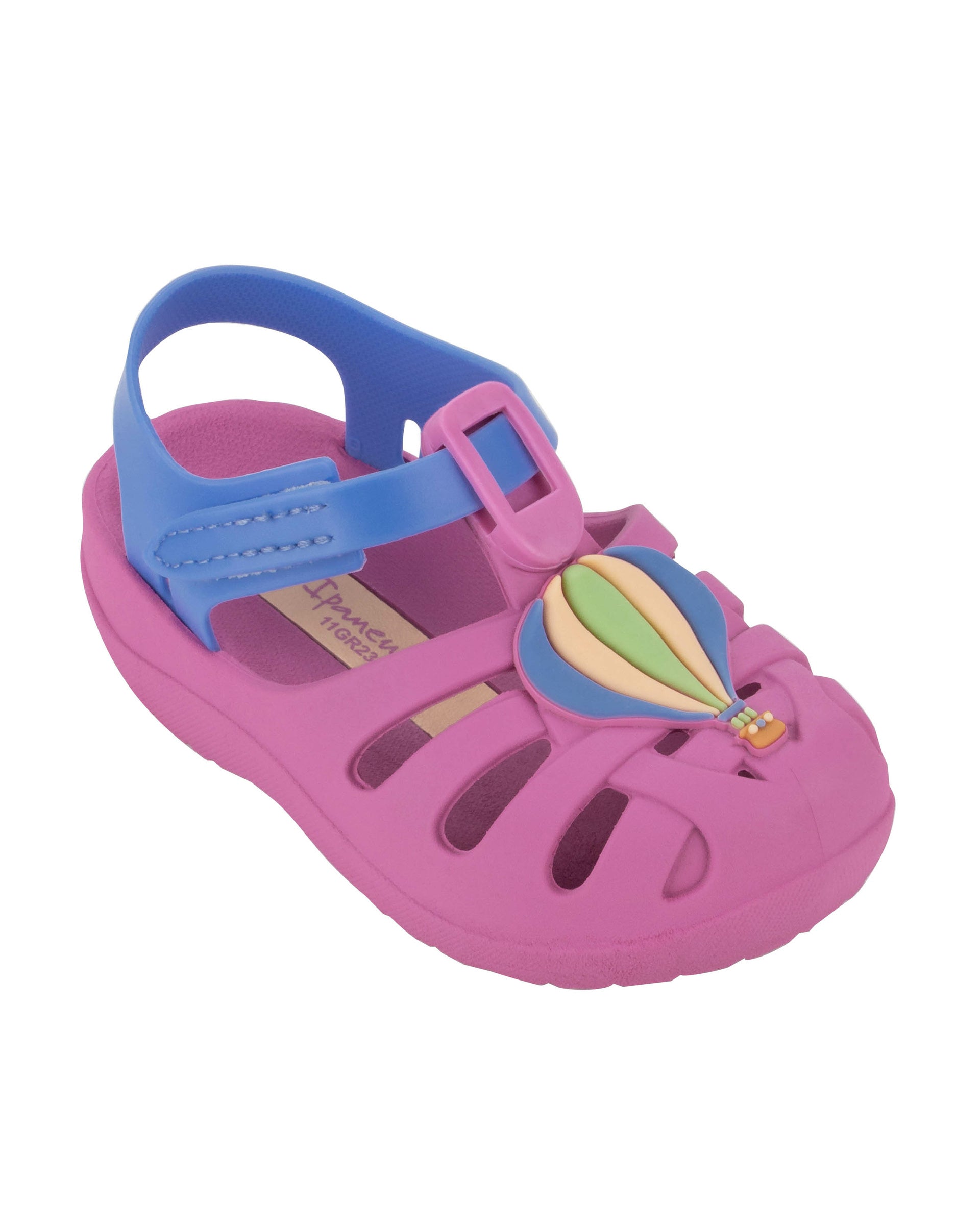 Angled view of a purple Ipanema Summer baby sandal with hot air balloon on the upper.