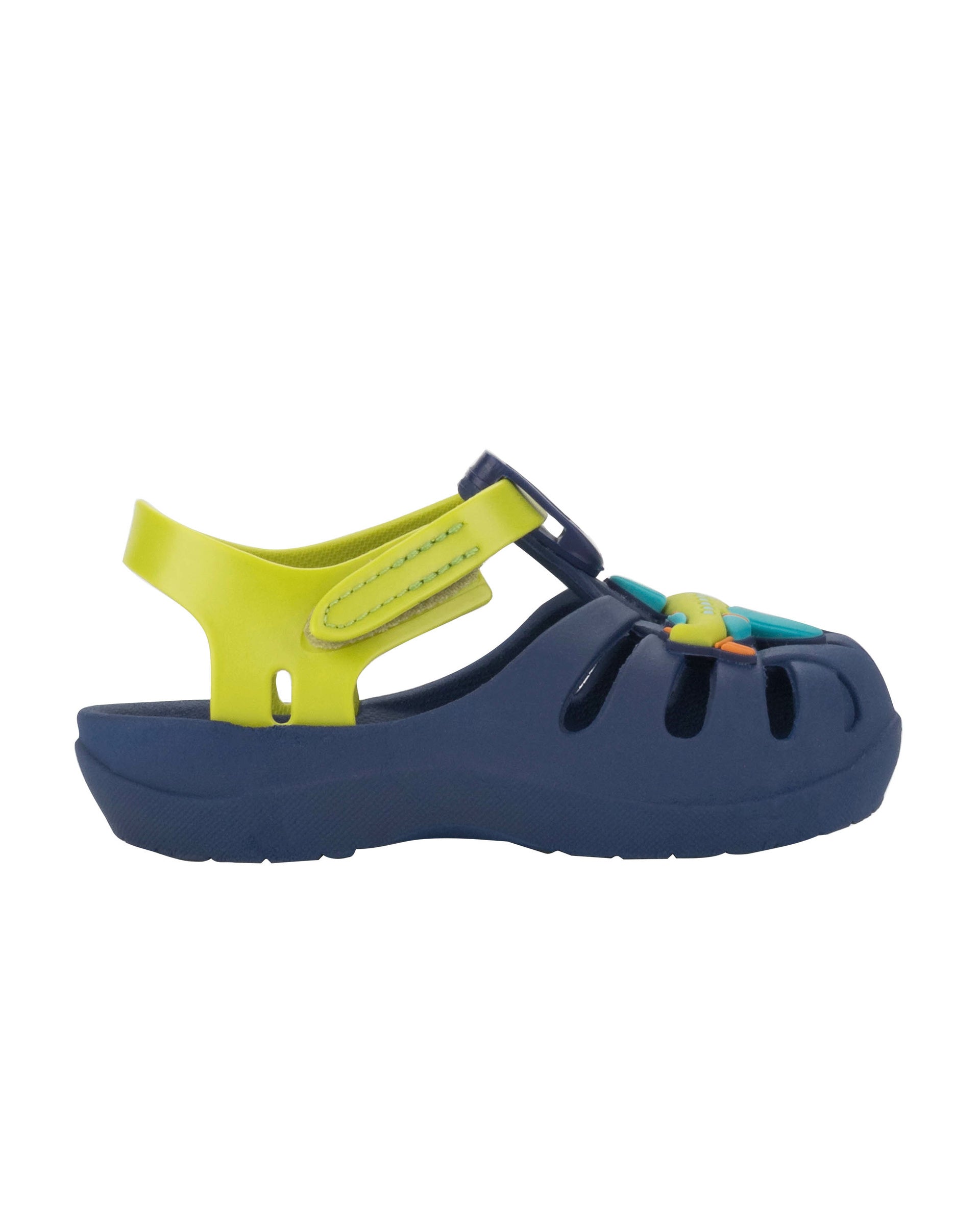 Outer side view of a blue Ipanema Summer baby sandal with airplane on the upper and a green strap.