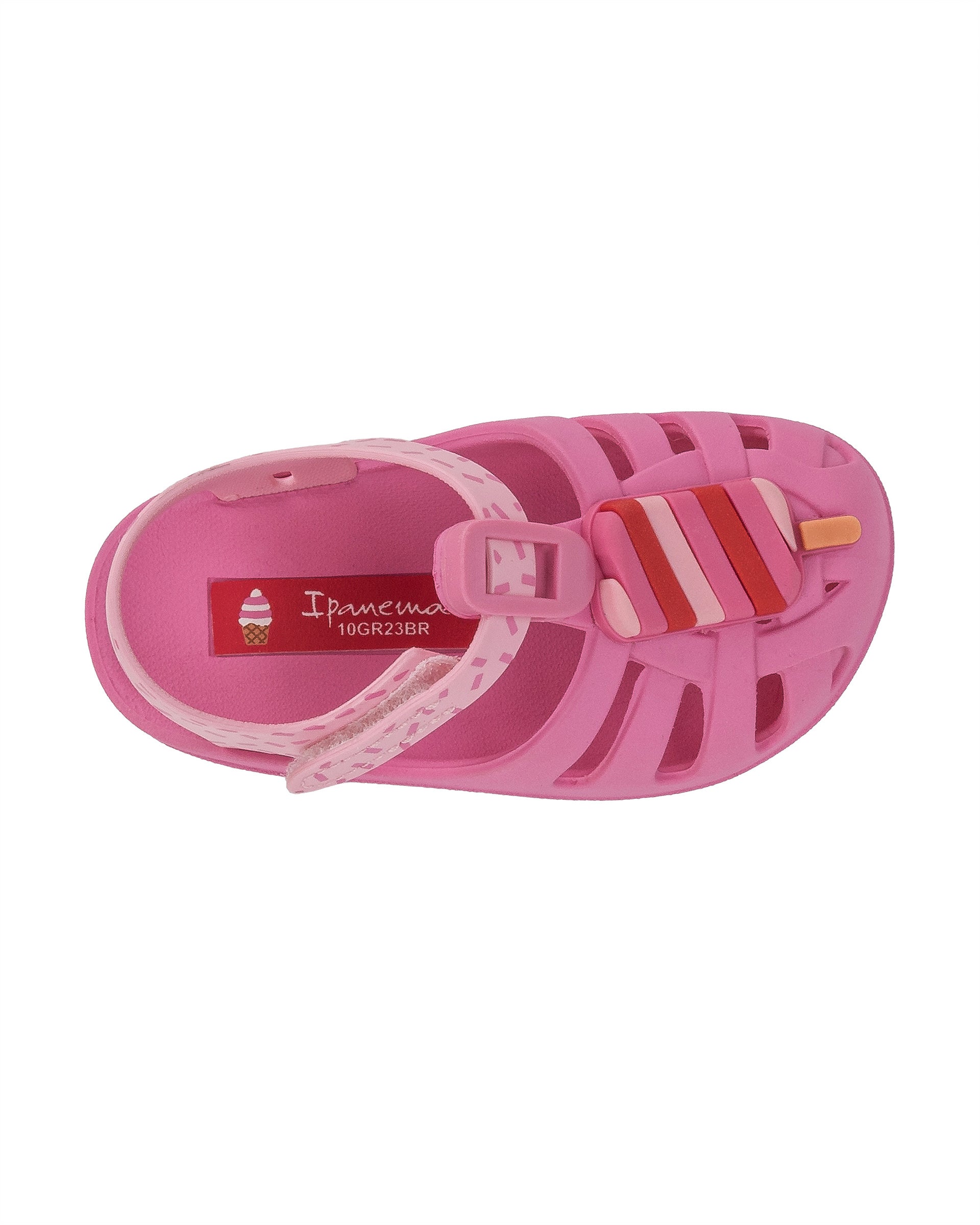 Top view of a pink Ipanema Summer baby fisherman sandal with a popsicle on the upper.