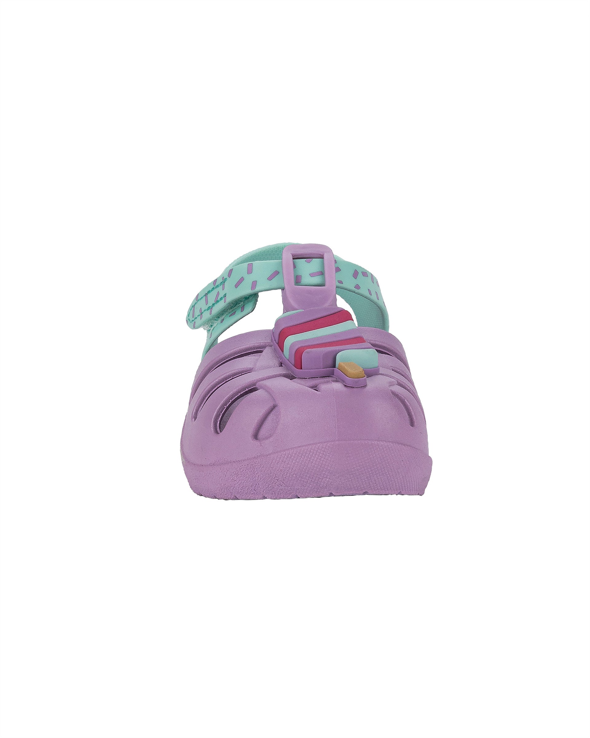 Front view of a purple and green Ipanema Summer baby fisherman sandal with popsicle on the upper.